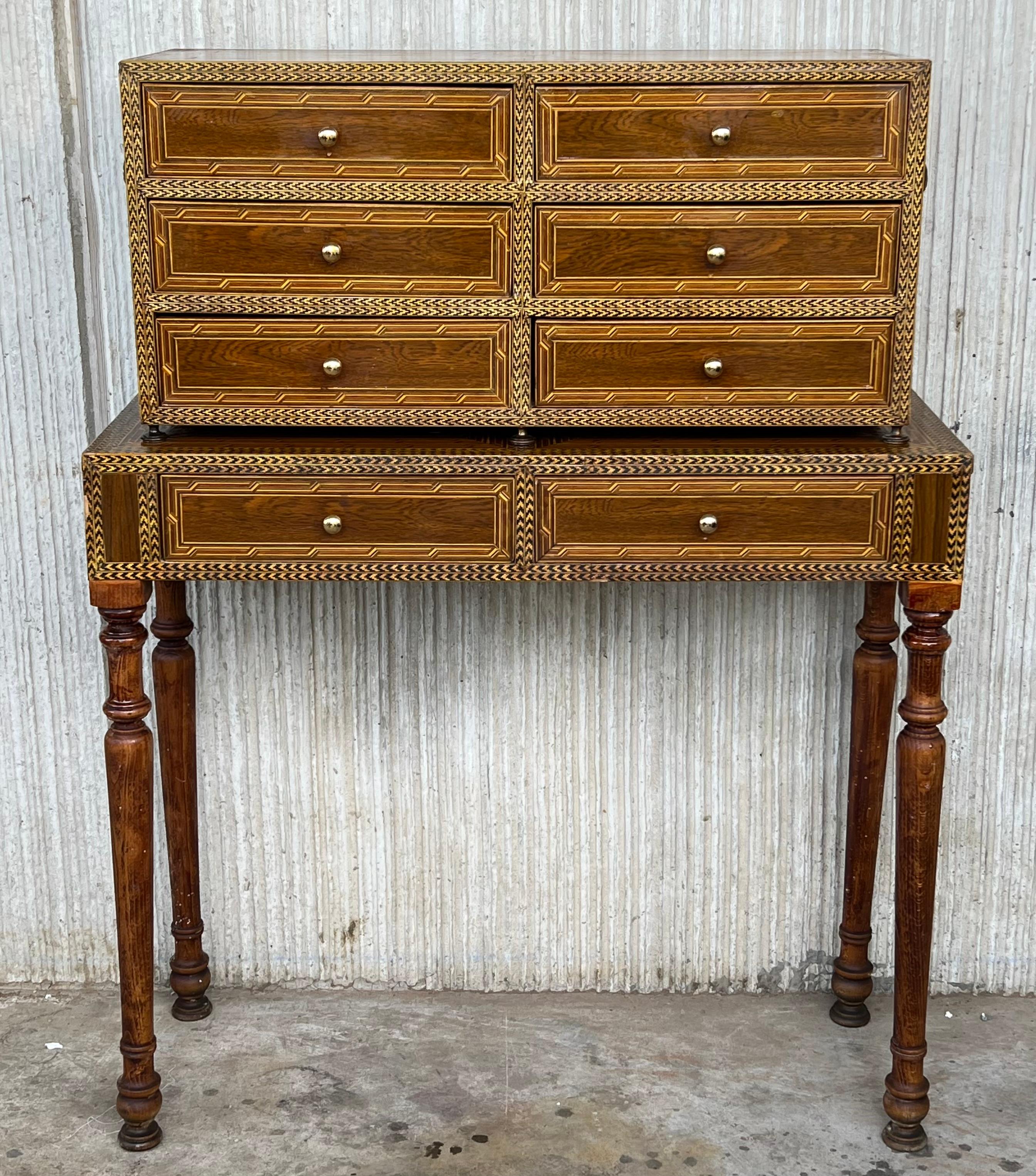 Italian cabinet on table. Beautiful Neoclassical style with six drawers in the high cabinet and two drawers in the table. In the sides table has a hidden compartment.

Measures: height to the top table : 30.70 in.