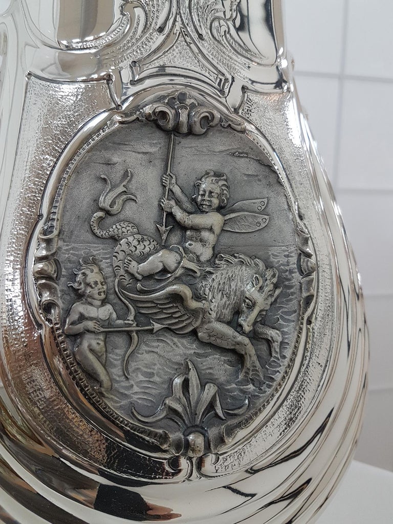 Solid 800°°/°°° silver vase with base completely handmade, embossed and ceased with two oval blason depicting ceased and burnished mythological figures.
 