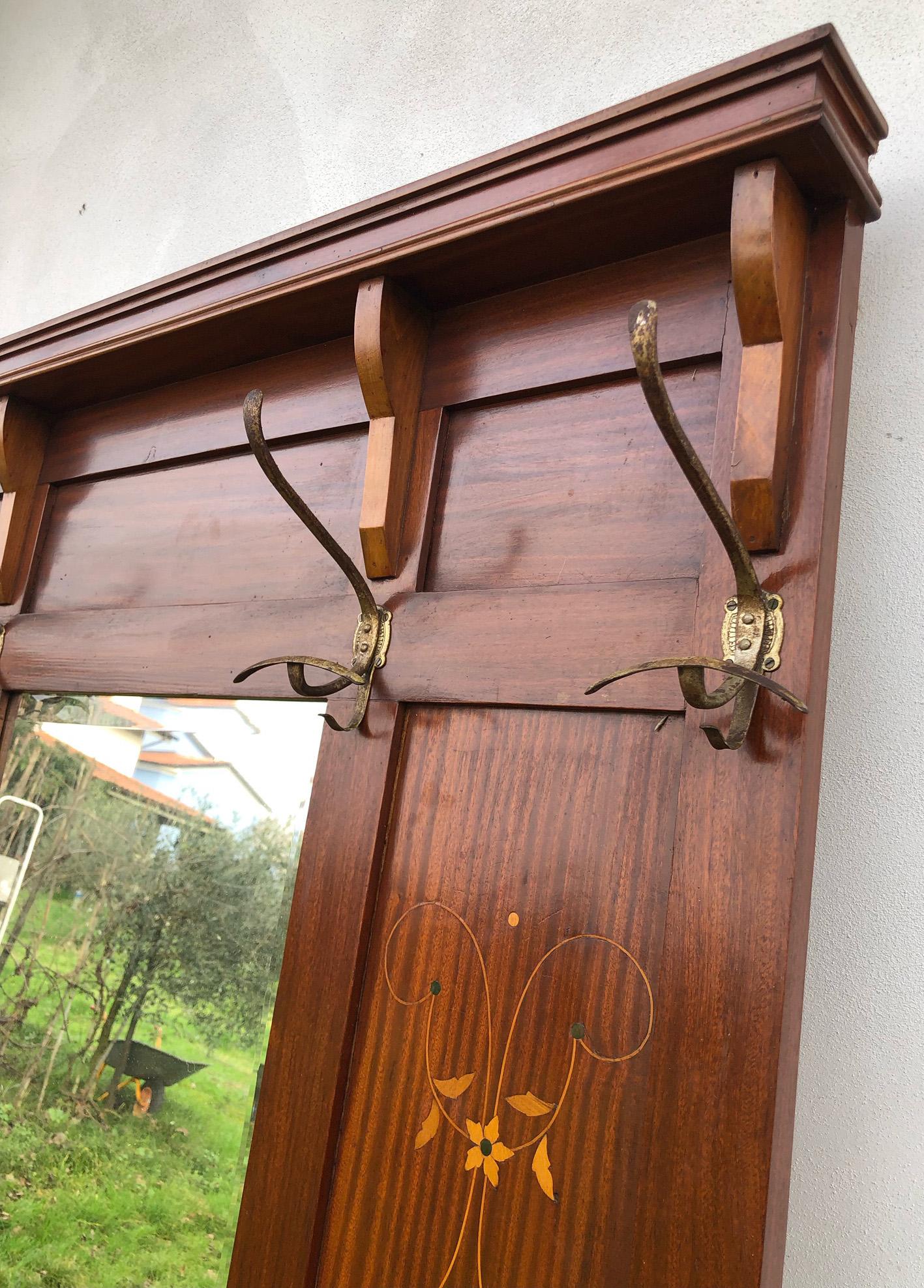 Early 20th Italian coat hanger inlaid with brass accessories, umbrella in the lower part.
It is very elegant, practical and comfortable. 
It was located at the entrance of an ancient building.
Original brass handles. 
Comes from an old luxury