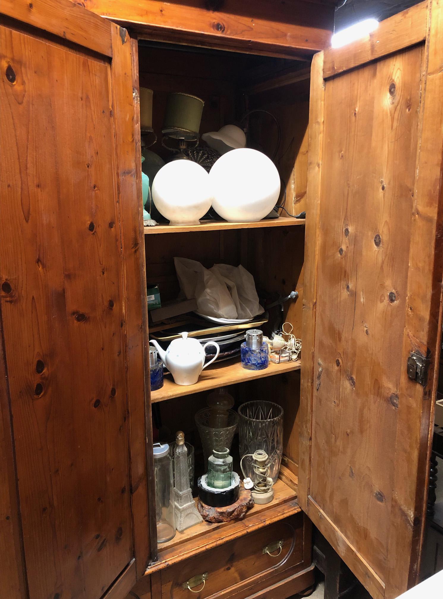 Italian wardrobe in original honey-colored solid pine handmade. 
It has three doors, three drawers at the bottom. 
In the area on the left it has a rod for hanging clothes and on the left two shelves for storing folded clothes.
Given the weight