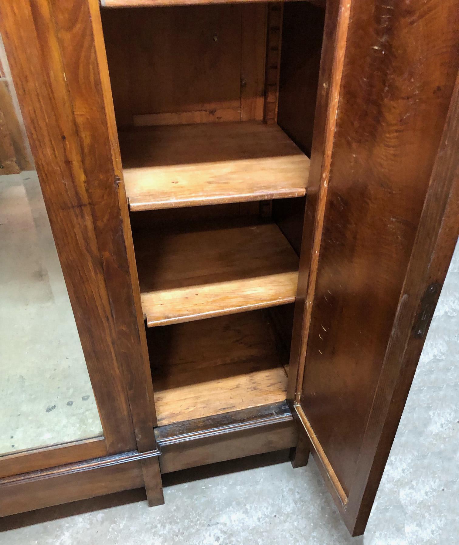 antique armoire with mirror and drawers