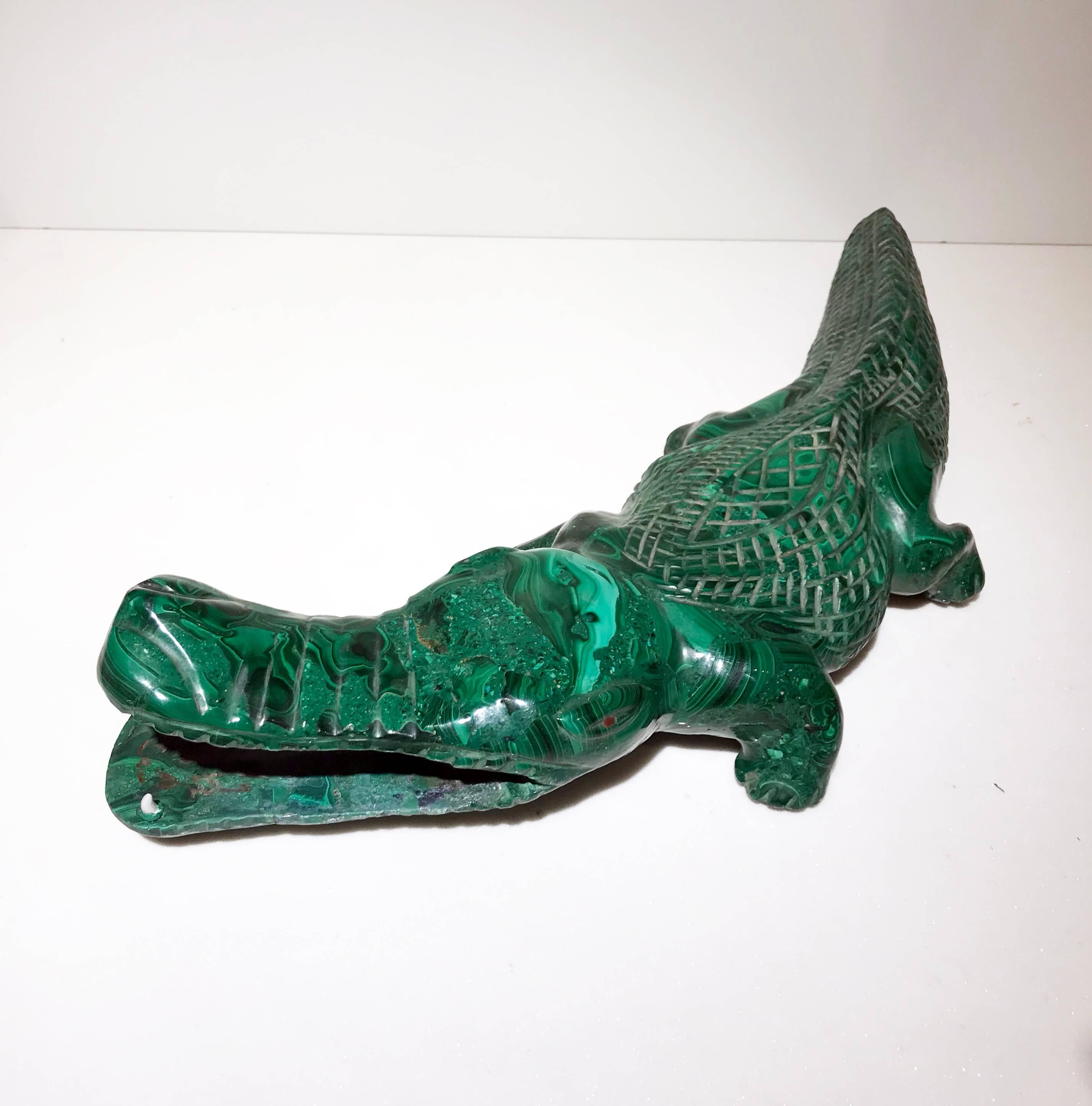 Carved from a block of beautiful and precious malachite, this sculpture represent a crocodile one of the most ancient beings with a large tradition of representation in art, for his iconic style and symbolism. The way in which the animal is carved