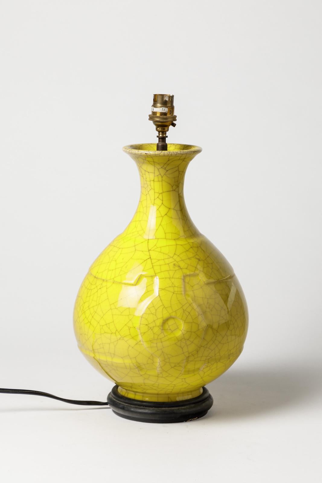 Art Deco ceramic table lamp

Elegant and shinny yellow ceramic glaze color

circa 1930, Art Deco period with asian art decoration and forms influences

original perfet condition

Electric system is ok

Lamp dimensions without electric