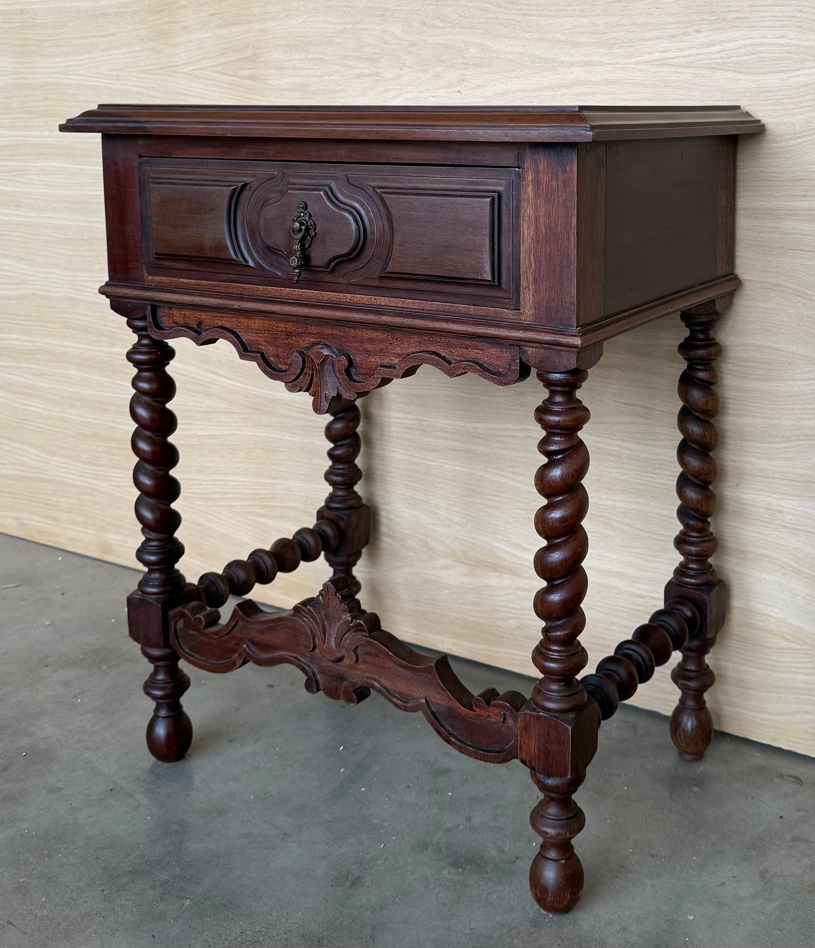 20th century Pair of Spanish nightstands with one drawer and iron hardware. The table has beautiful carved drawers with original iron pull. Beautiful tables that you can use like a nightstands or side tables, end tables or table lamp, desk or