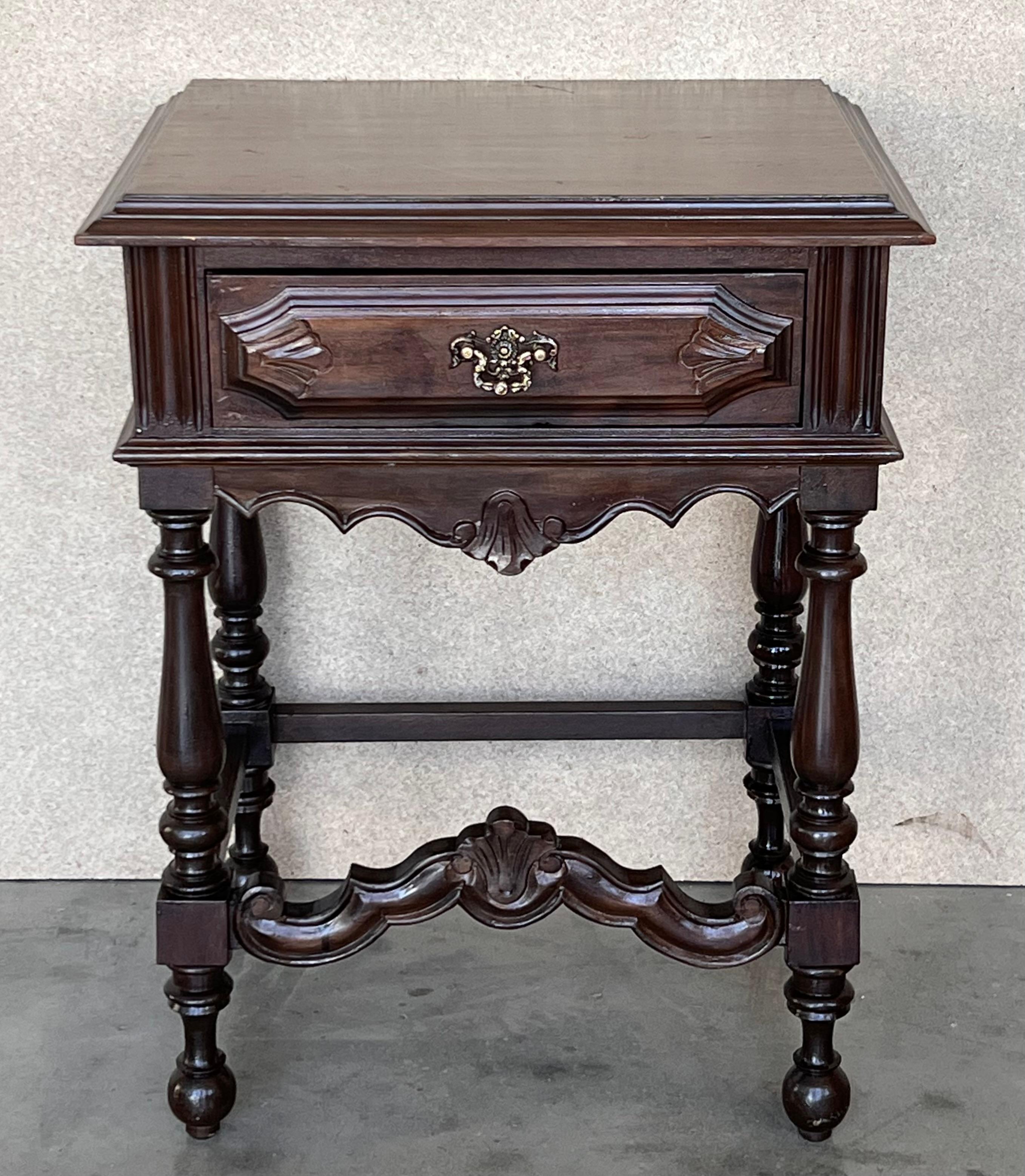 20th century Pair of Spanish nightstands or console table with one drawer and iron hardware. The table has beautiful carved drawers with original iron pull. Beautiful tables that you can use like a nightstands or side tables, end tables or table