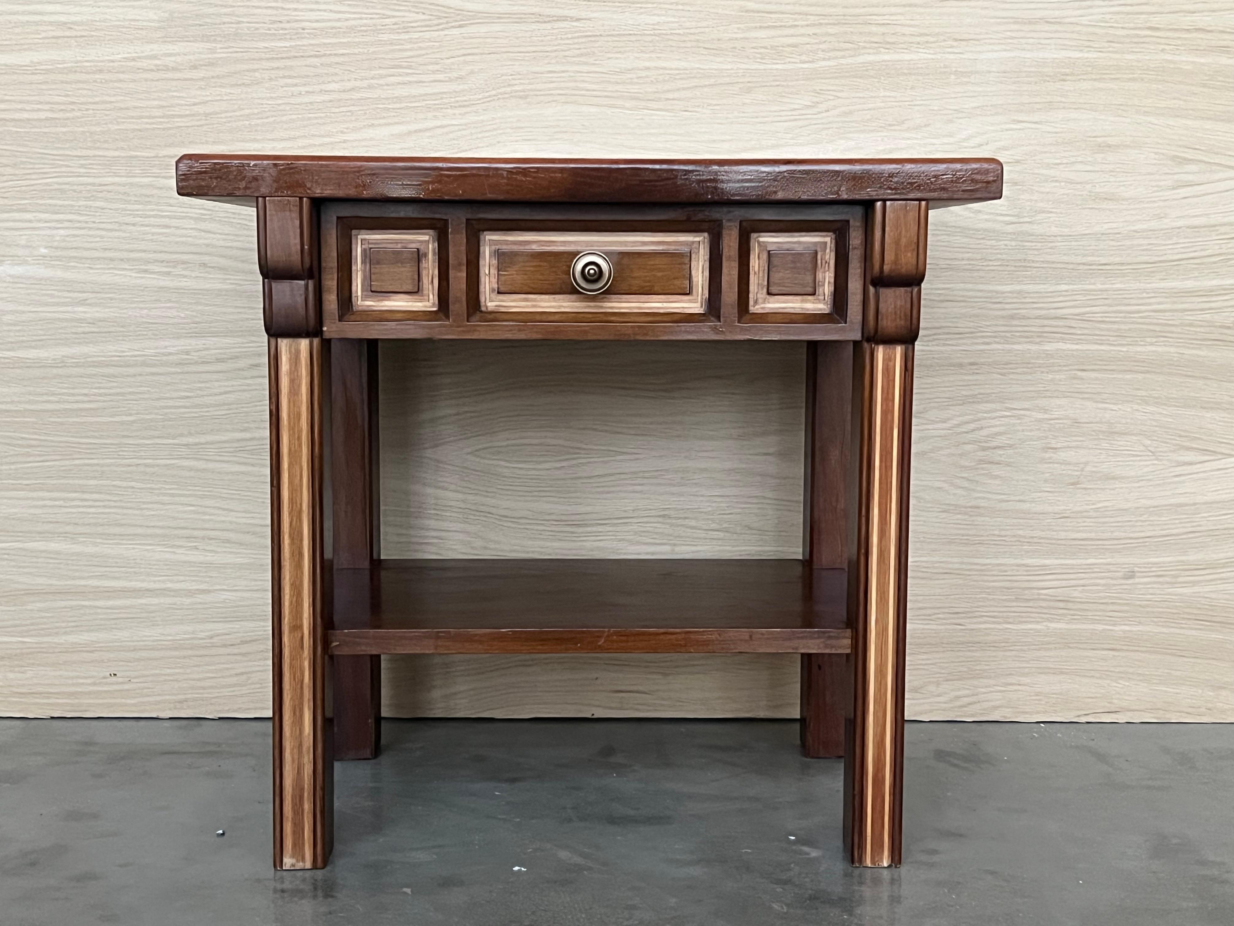 20th century Pair of Spanish nightstands with one drawer and low shelve. The table has beautiful carved drawers with original color contrast. Beautiful tables that you can use like a nightstands or side tables, end tables or table lamp, desk or
