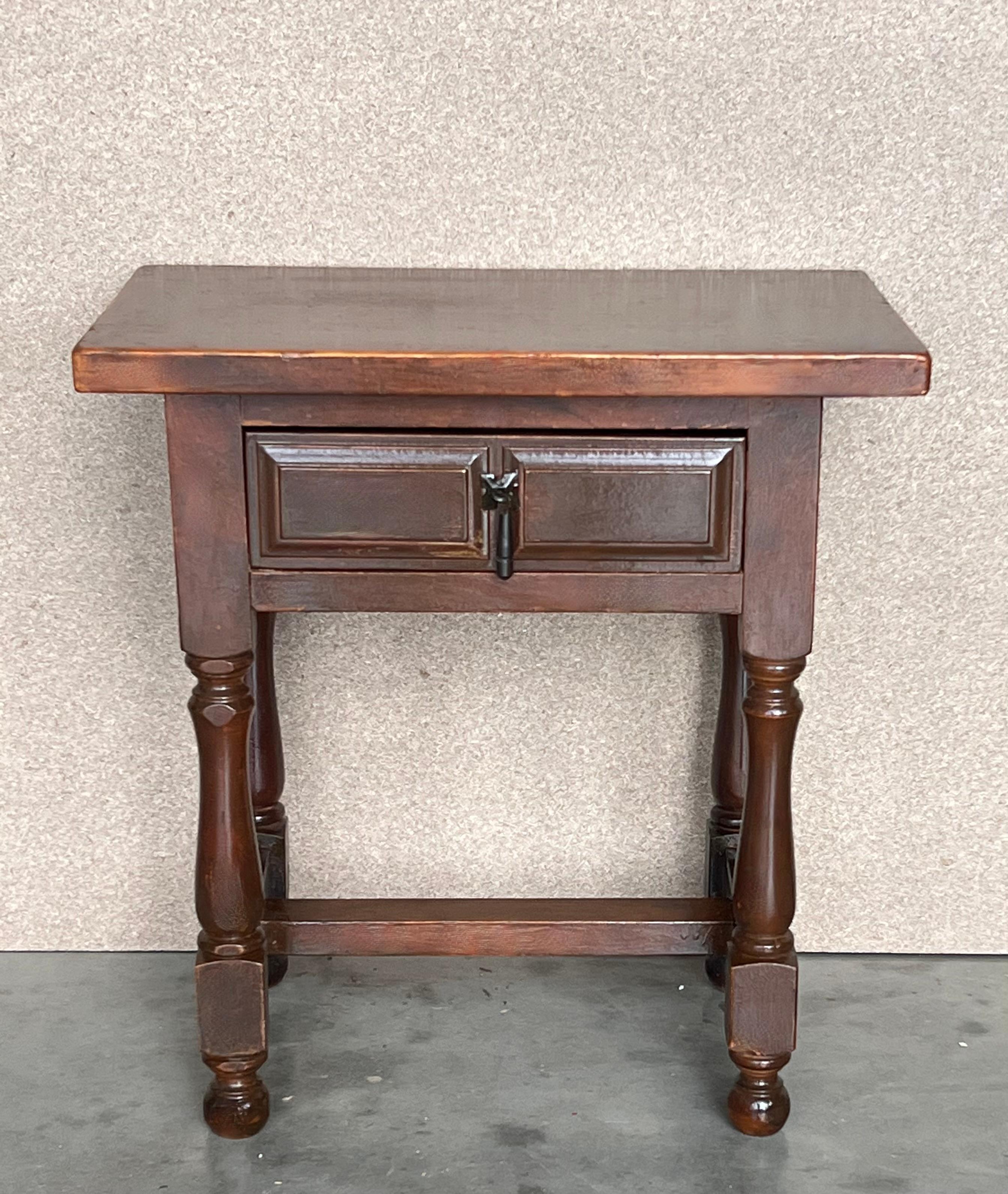 20th century Pair of Spanish nightstands with one drawer and iron hardware. The table has beautiful carved drawers with original iron pull. Beautiful tables that you can use like a nightstands or side tables, end tables or table lamp, desk or