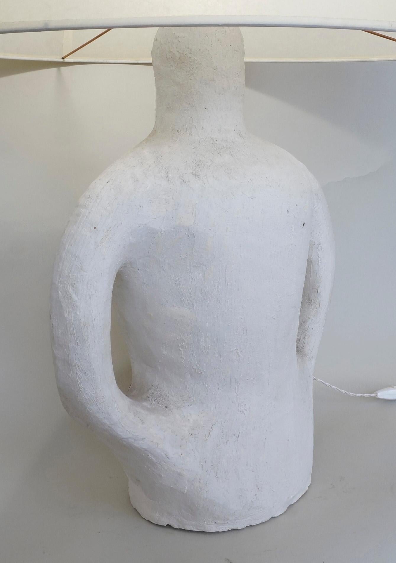 Anthropomorphic plaster table lamp, custom made upholstered lampshade.
Rewired with twisted silk cord
Mesures : plaster height : 47 cm - 18,5in
Height with lampshade : 79 cm - 31,1in.