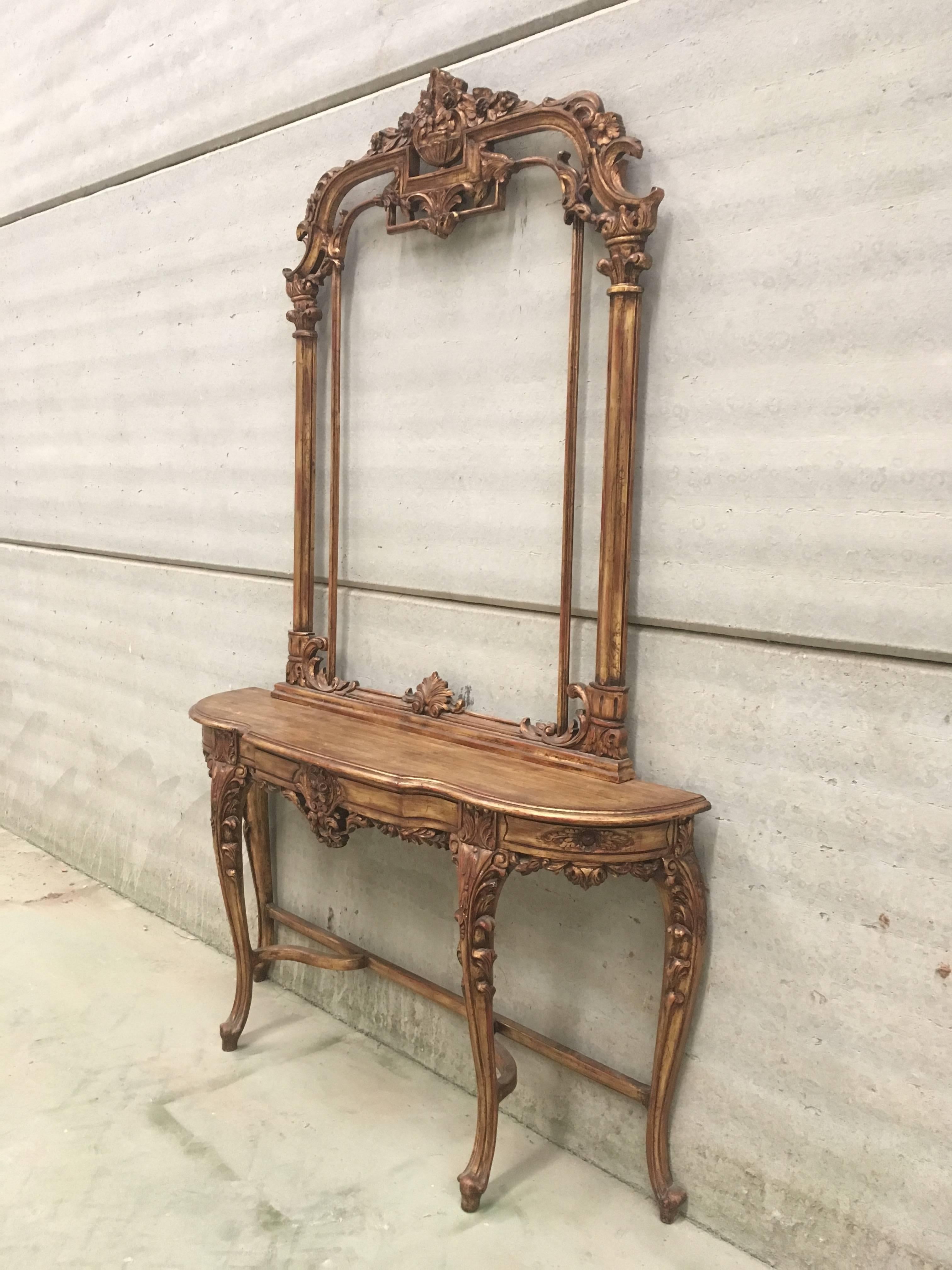 20th century fine Renaissance carved and gilded walnut pier mirror frame and console table with beautiful original patina

Mirror measurements:
Width 45.66in
Height 57.87in
Depth 2.16in.