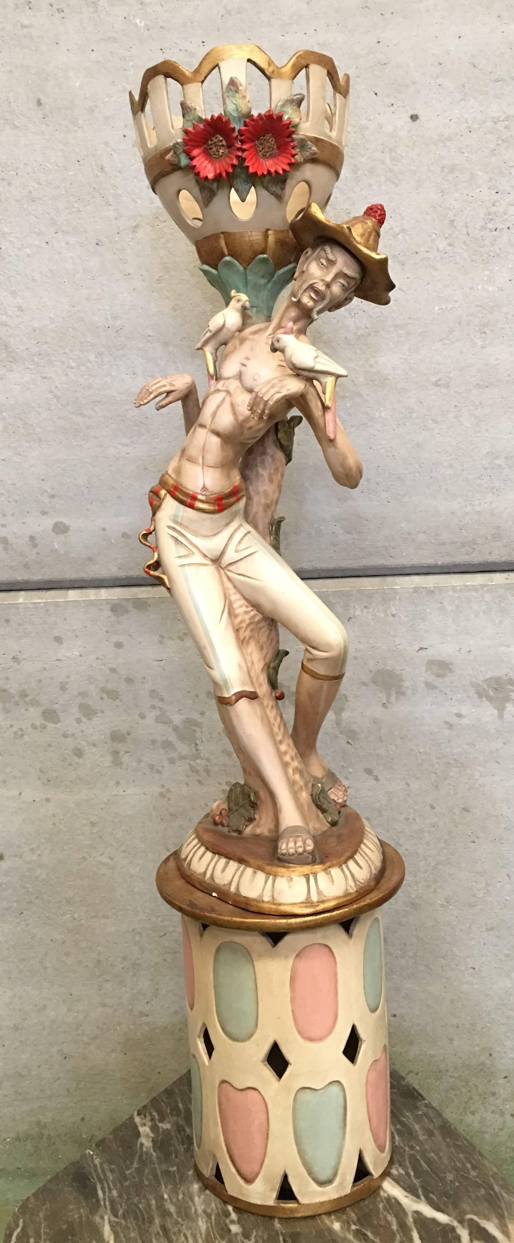 This alluring statue will elevate any interior decor. 
Nimble and flexible yet astute and clever, this statue is here portrayed in the midst of a traditional dance. The masterful details distinguish this piece, notable in the iconic, multicolored,