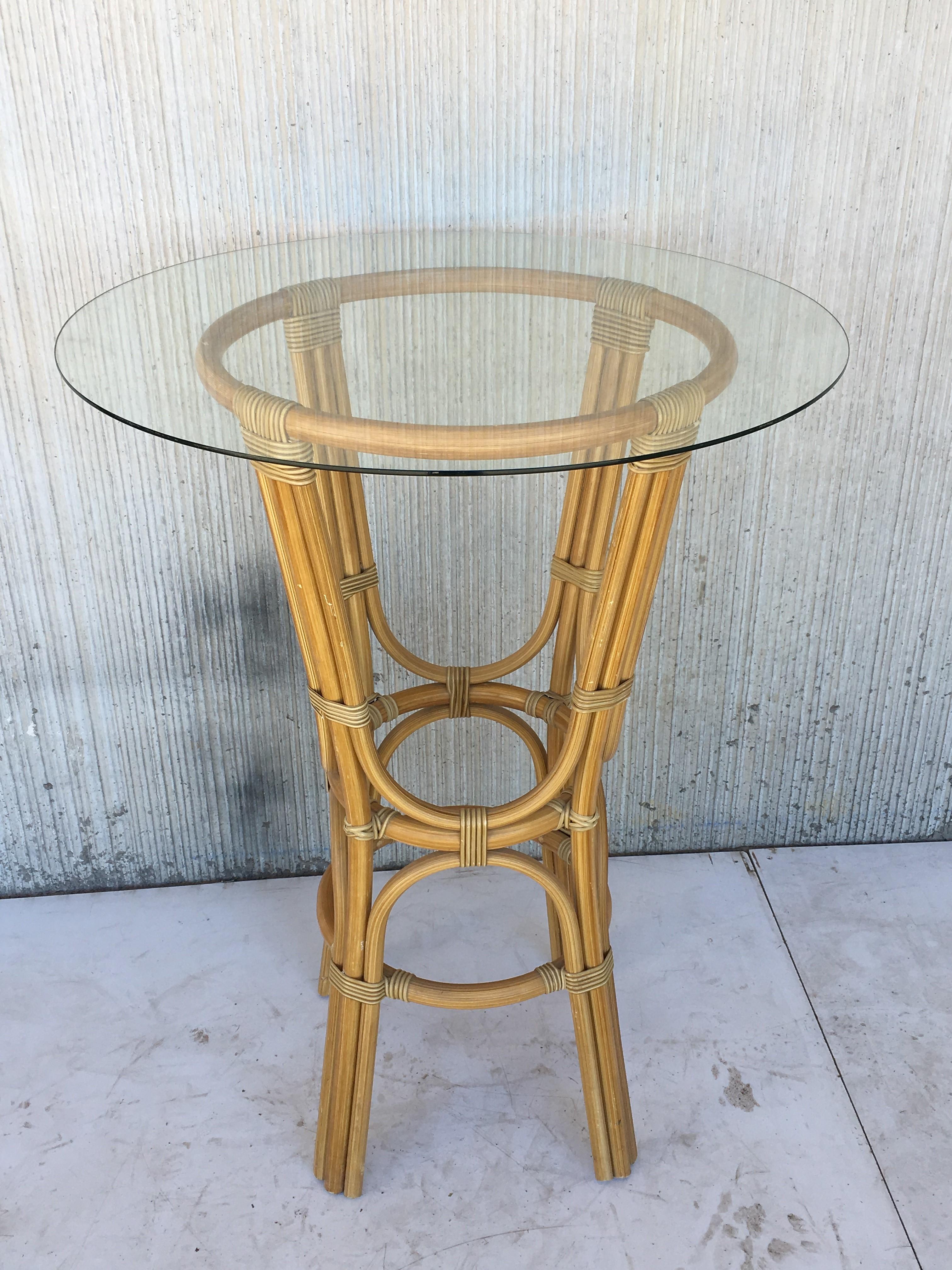 20th century set of four high round cocktail table in faux bamboo with glass top

Measurements of glass top: 35.75in diameter.
