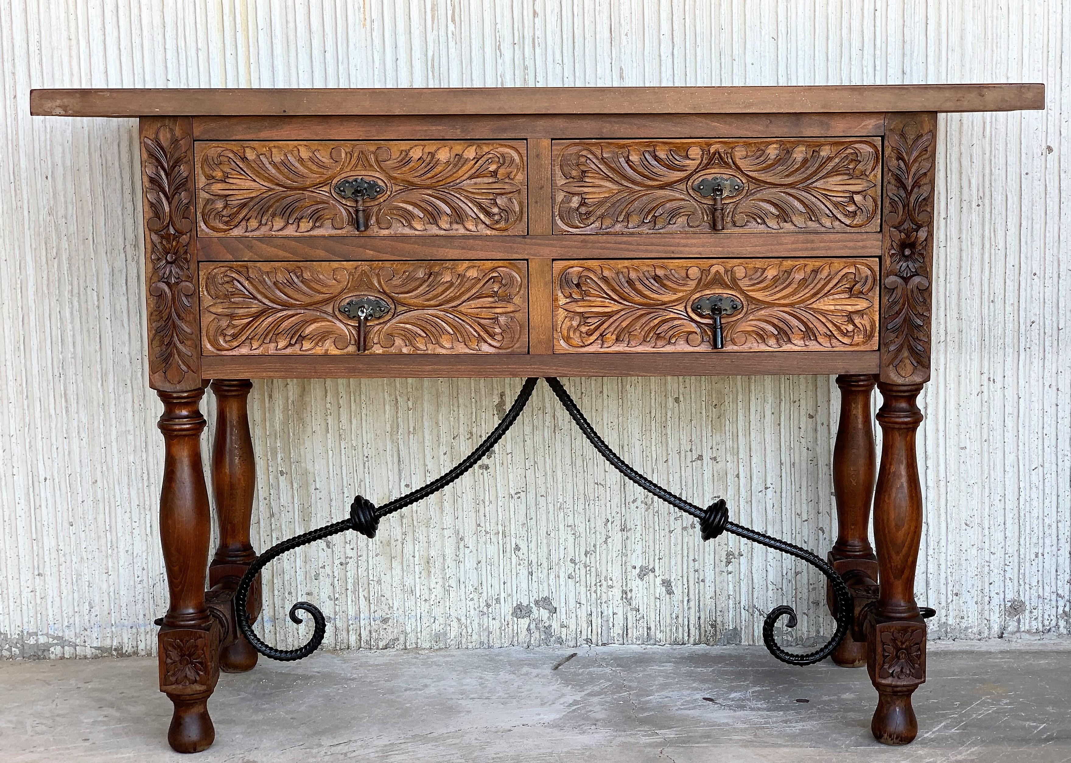 20th century Spanish carved walnut console sofa table with four drawers and iron stretcher
You can use like a commode or chest of drawers
This elegant antique walnut console was crafted in spain, circa 1900. The sofa table with four legs and