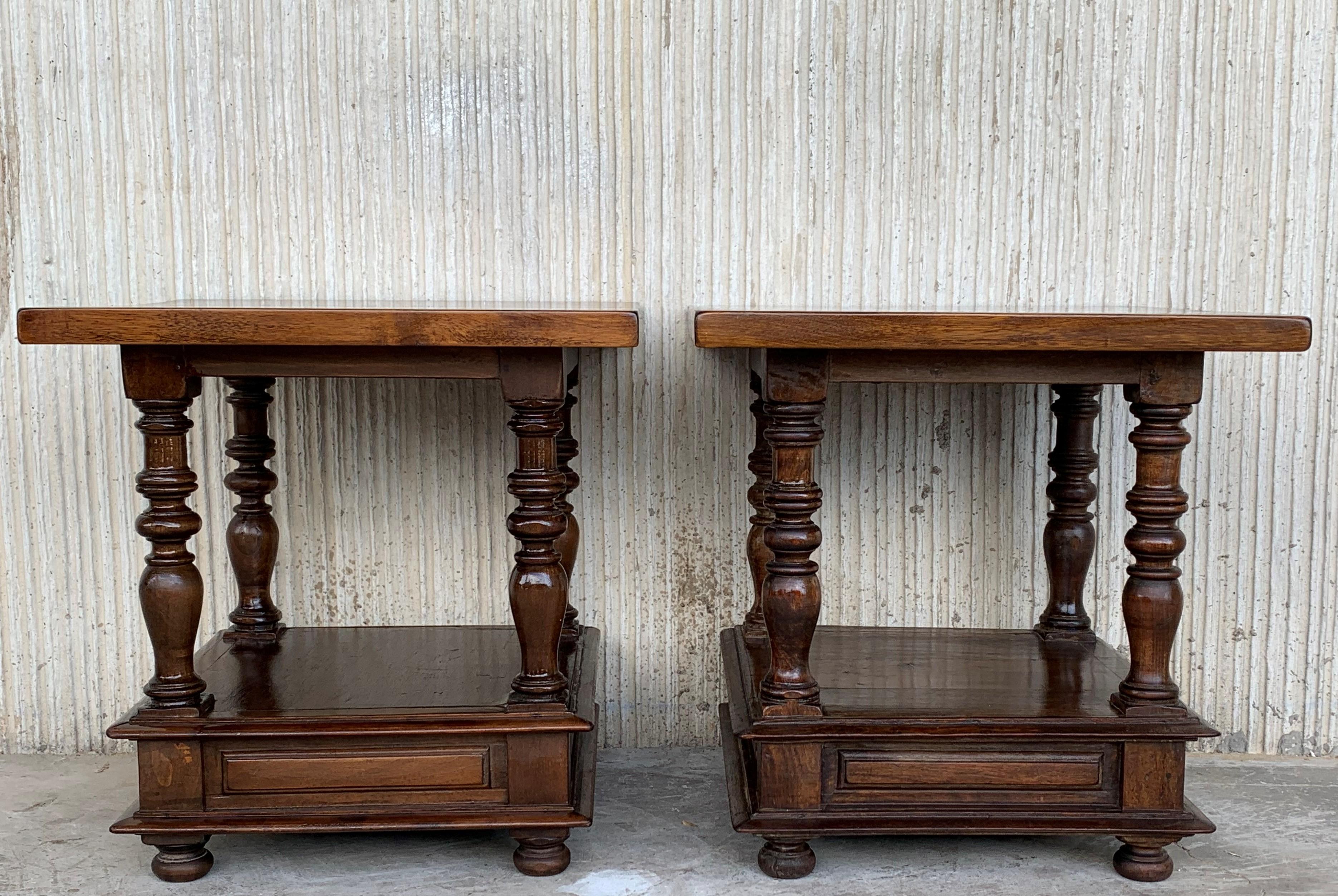20th century Spanish colonial pair of square solid walnut coffee tables with low shelve.