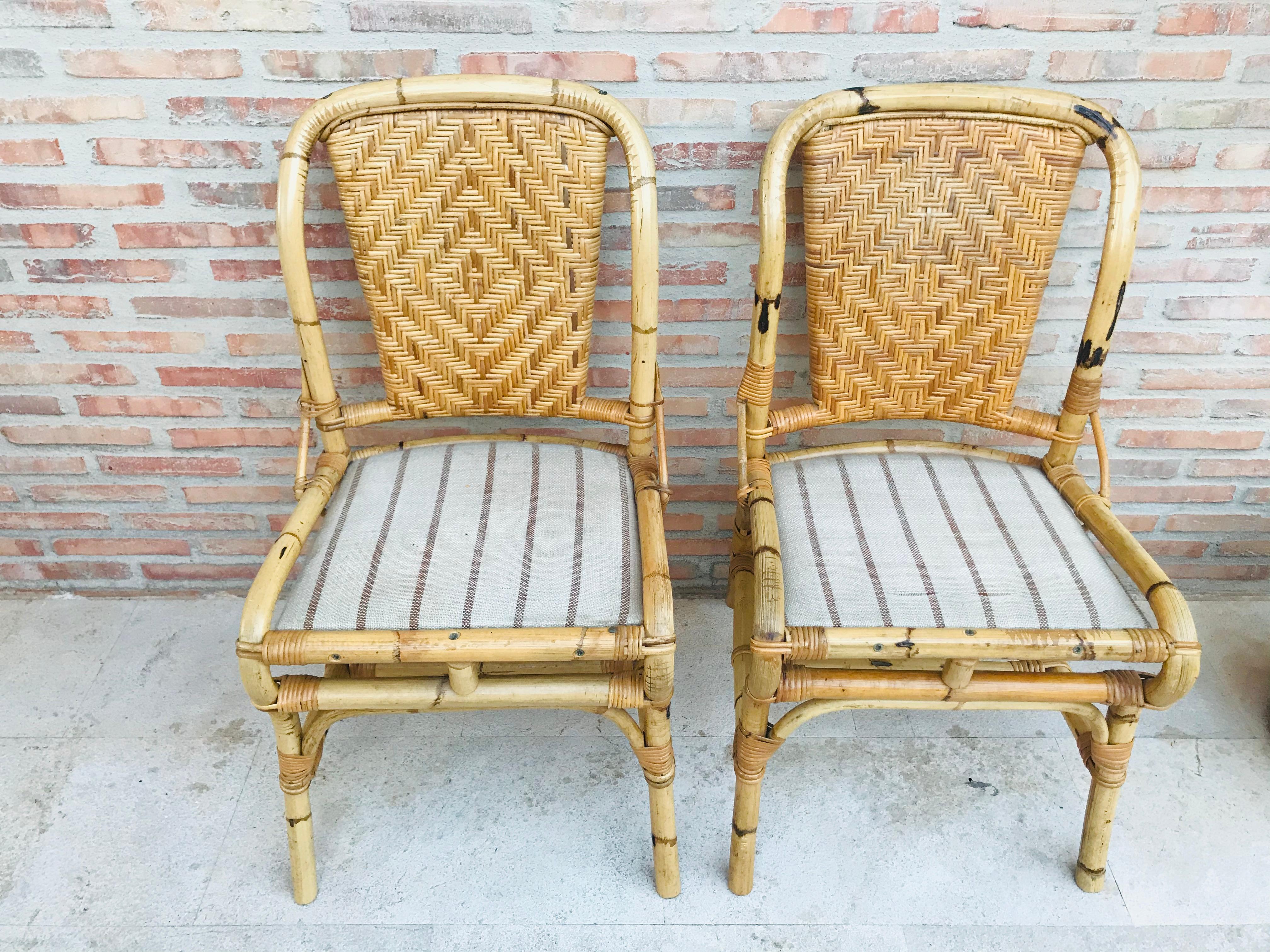 20th Spanish midcentury pair of bamboo chairs with upholstered seat.