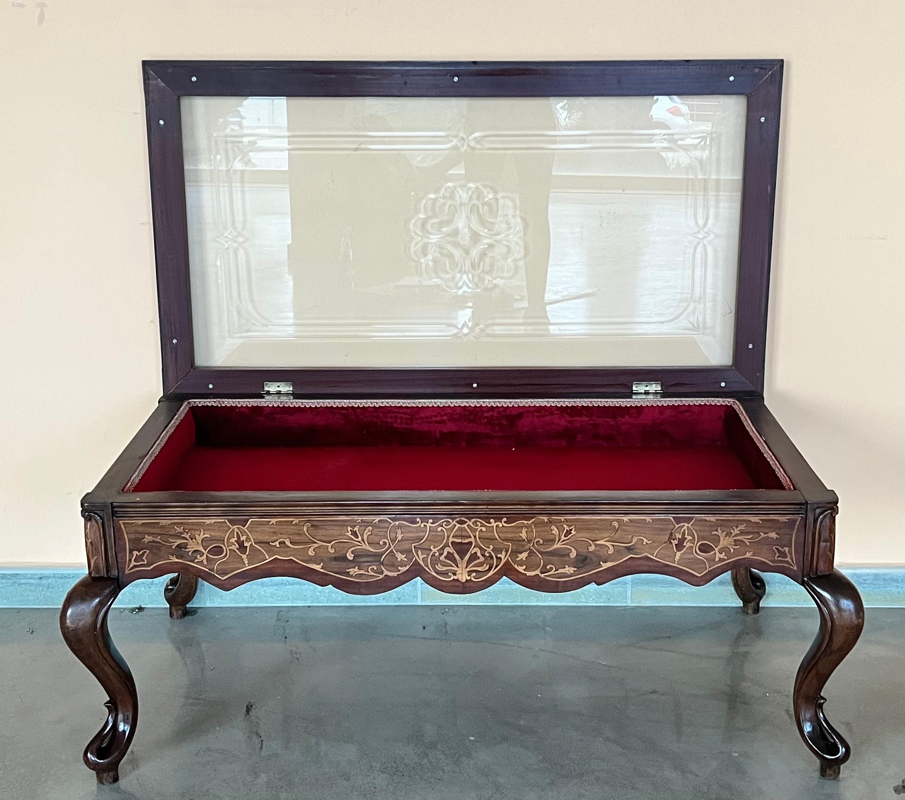 For sale is a fine quality 20th century Bijouterie table. The top of the table as a superbly inlaid edge around the hinged lid. The lid lifts to reveal a velvet lined interior. The table stands on elegant shaped and tapered cabriole legs, each with