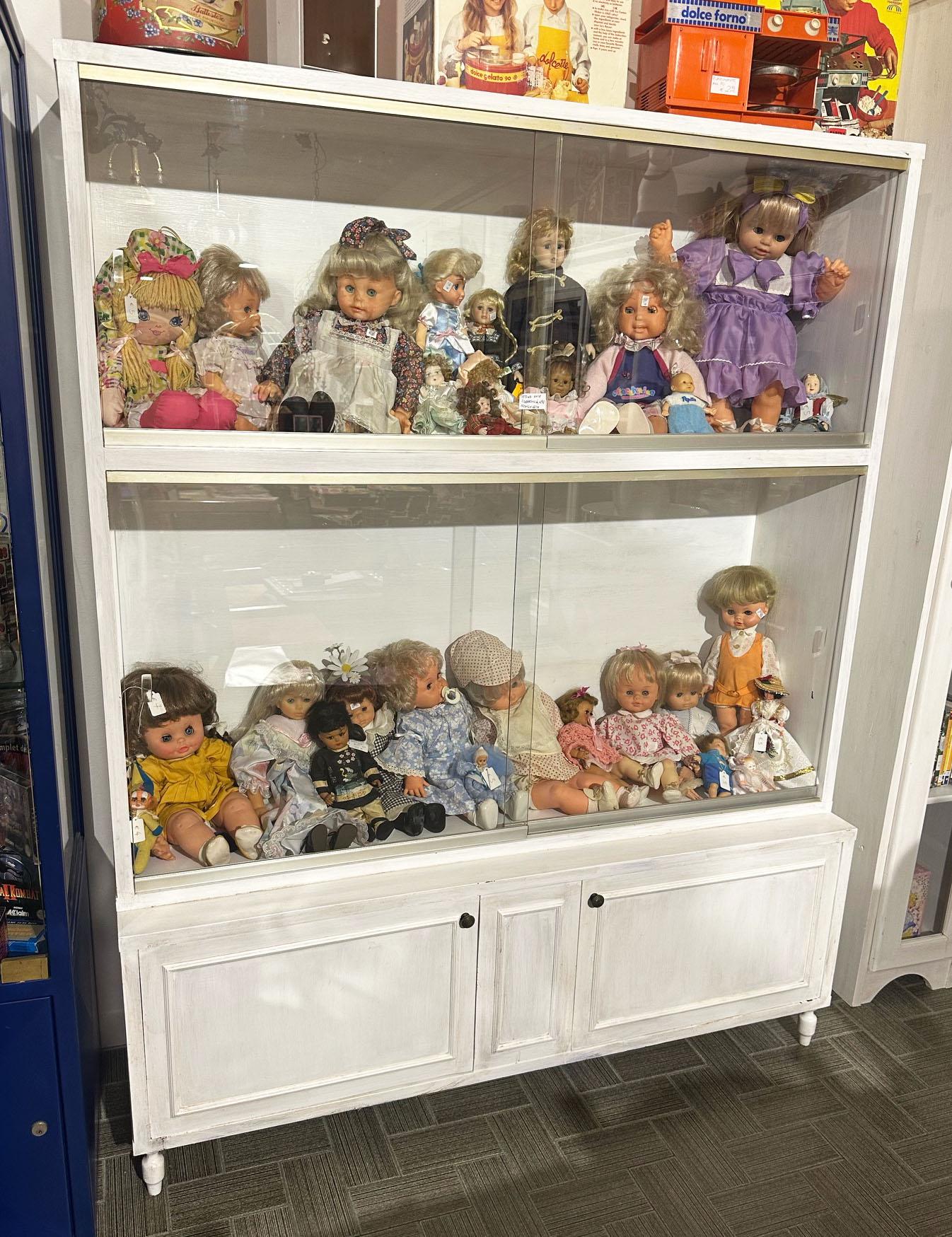 20th White shabby chic bookcase display cabinet with four sliding doors for display, with two lower doors. The cabinet is very roomy, with an internal useful depth of 35cm.
Comes from an old shop   in the center of Florence  area of Tuscany.
The