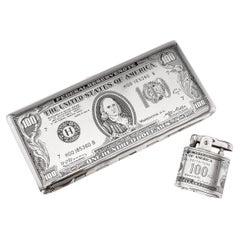 Portasigarette e accendino americano placcato argento del XX secolo a forma di cento dollari