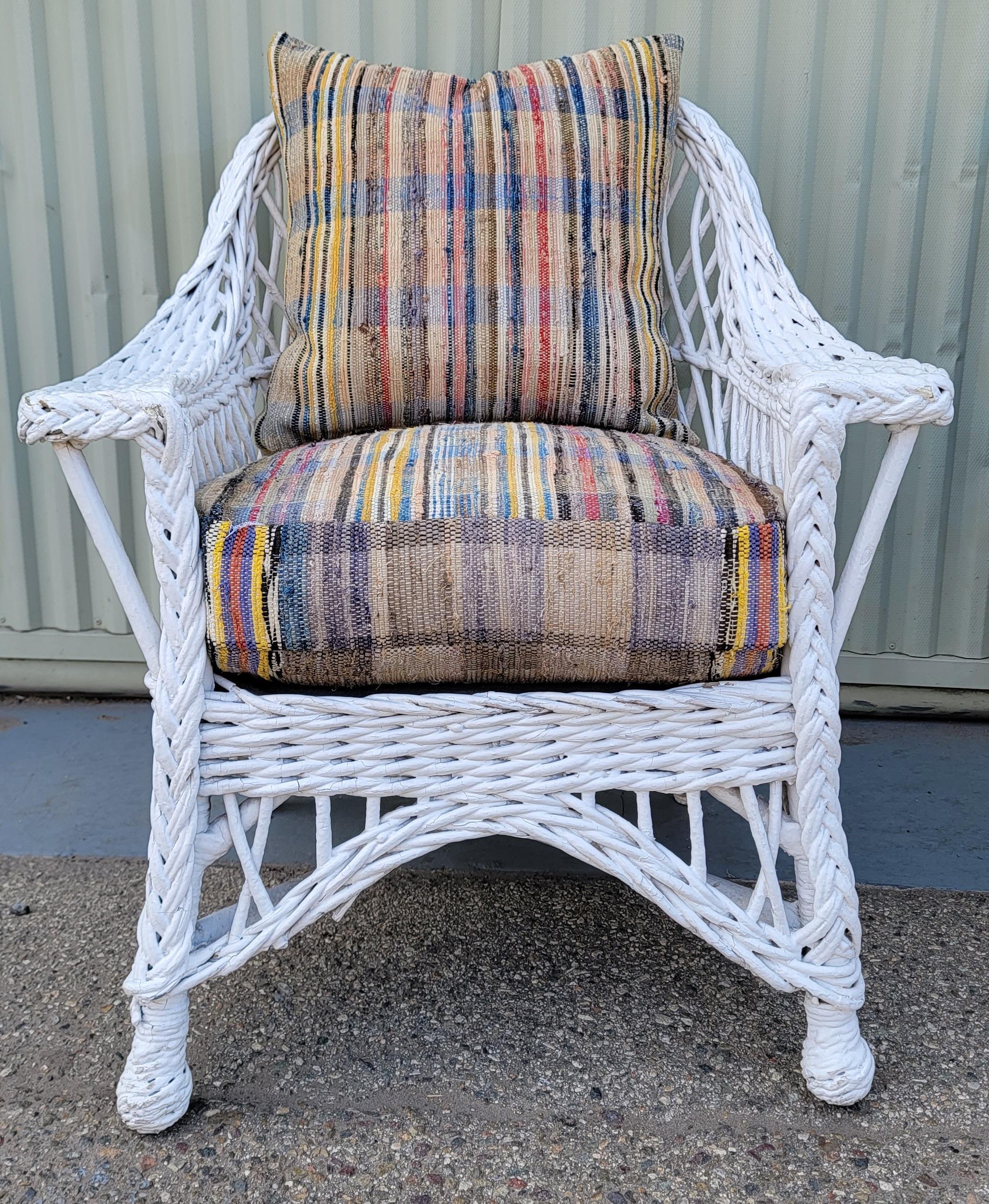 20Thc Haywood Wakefield original white painted wicker settee & matching arm chair. This amazing original white wicker set is in fine & very strong and sturdy design/condition. 
The set is newly upholstered in vintage cotton double sided custom rag