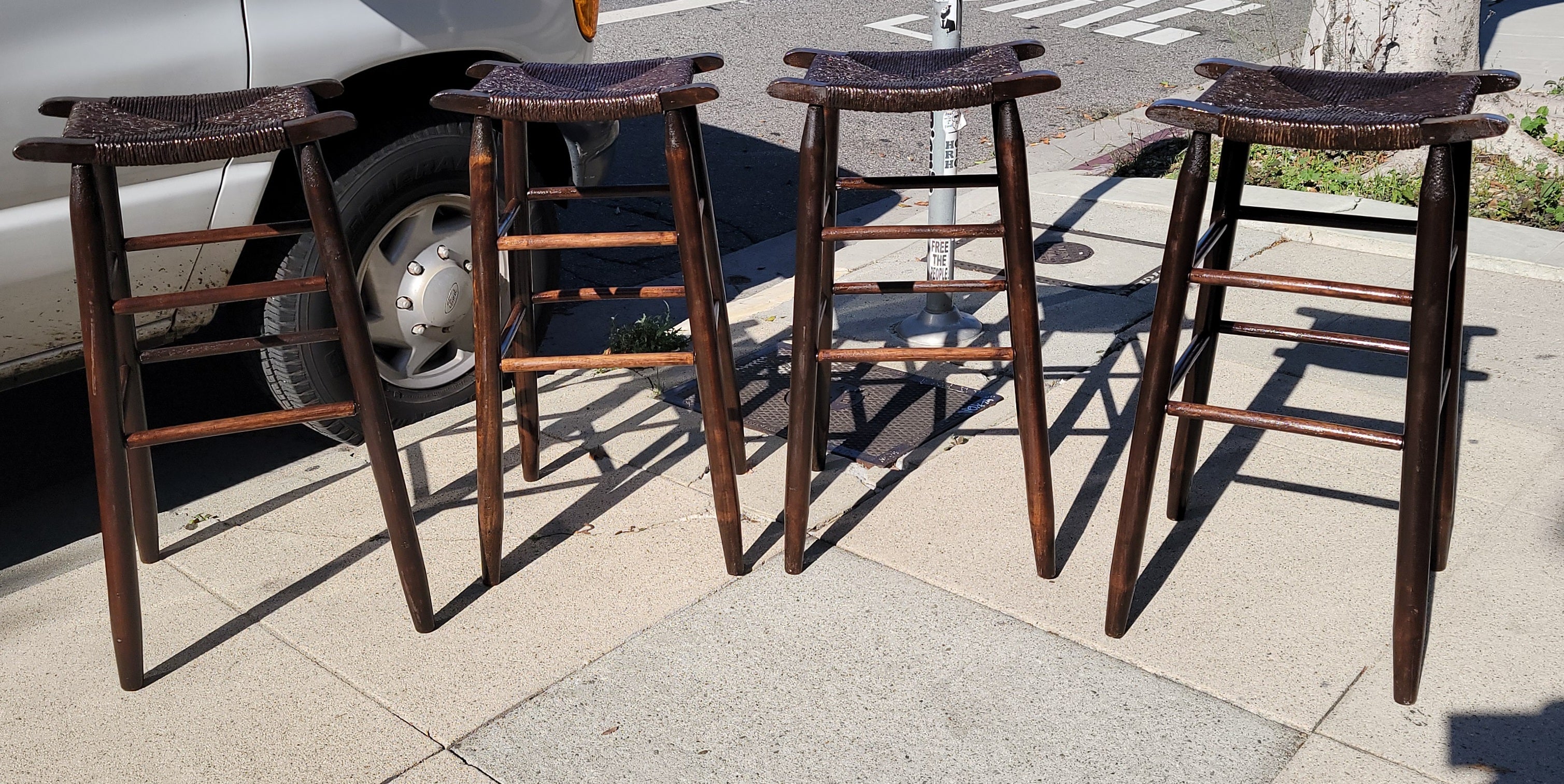This set of complete matching bar stools have a wonderful dark surface or stain and in very good condition.They are strong & sturdy and very comfortable.