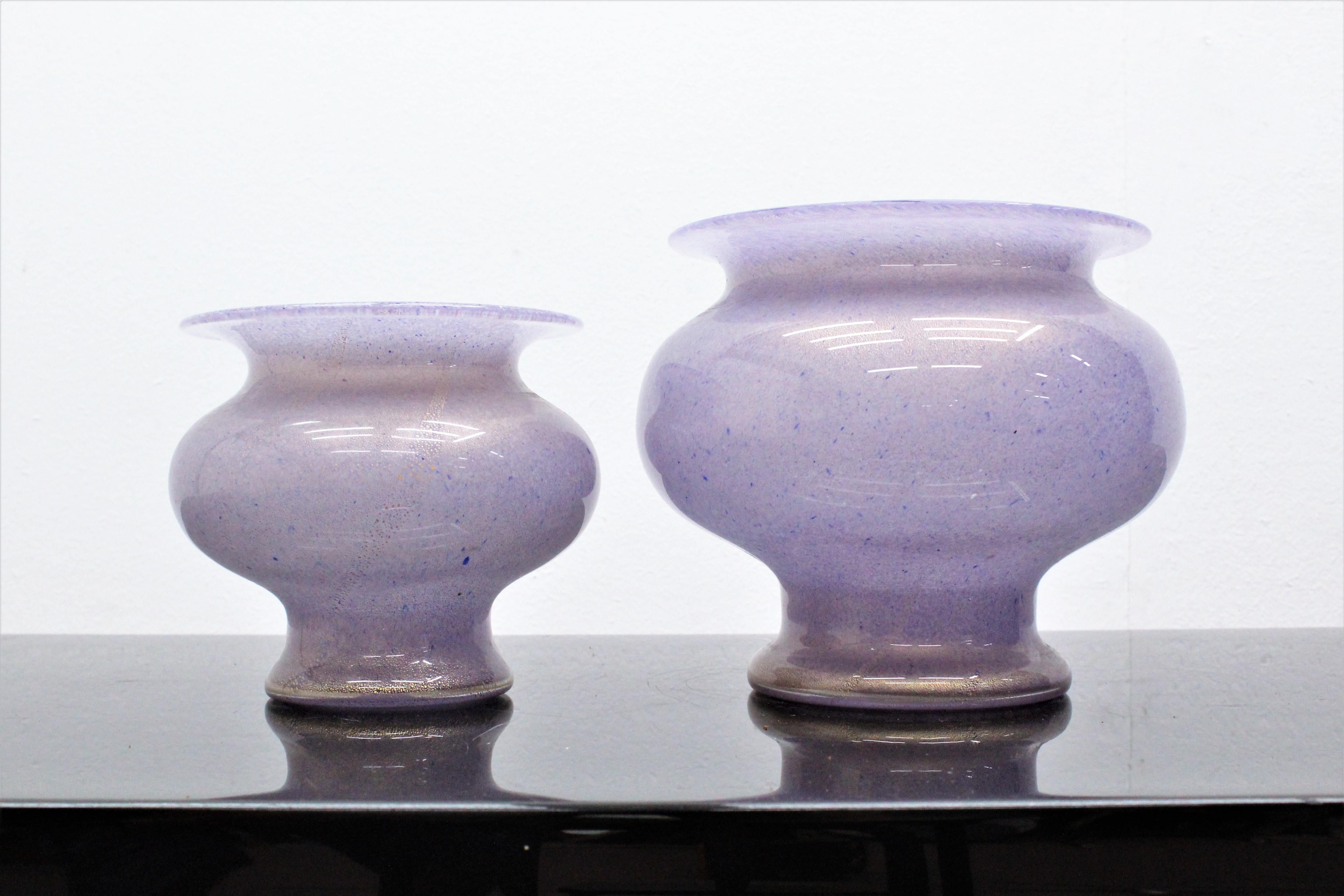 Beautiful pair of Murano vases in submerged lilac color with gold leaf inclusions by Barovier & Toso in 1950s.
The mark is engraved on the bottom.

Wear consistent with age and use.


 