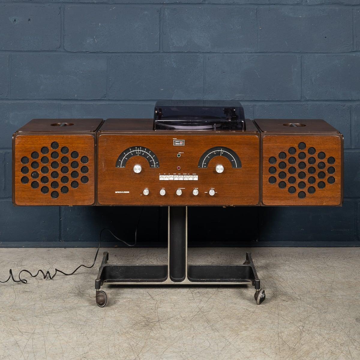 The Brionvega RR-126 is an icon of Pop design. It was conceived as an anthropomorphic ‘musical pet’, with speakers for ears and control dials for its face. It could be moved around easily on its castors, allowing it to operate in concert with other