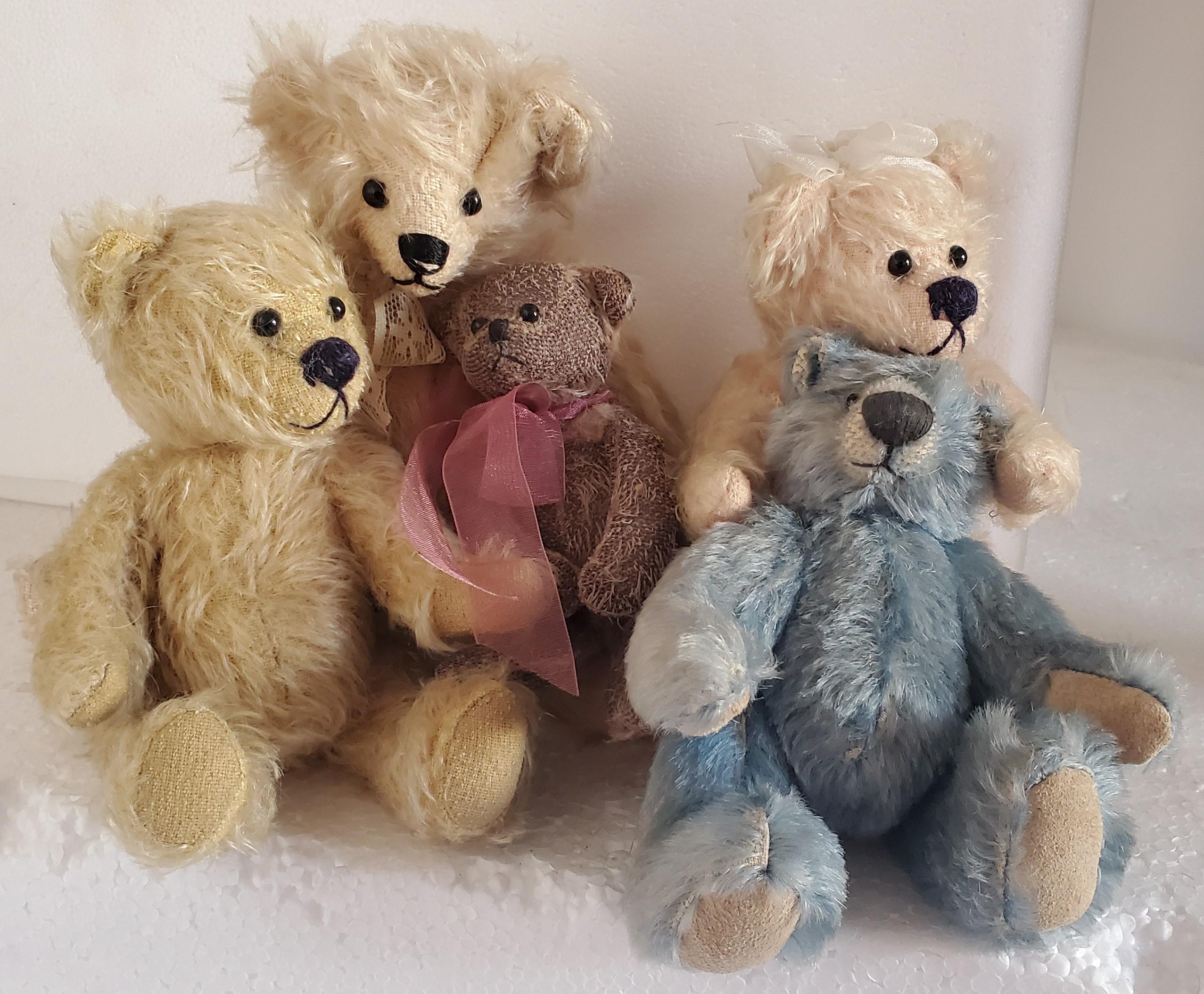 Collection of 5 contemporary bears. All bears are jointed and in great condition. Minor loss of fur to smallest bear. 

Largest bears measures:
9 high x 5 wide
Smallest bear measures:
7 high x 2 wide.