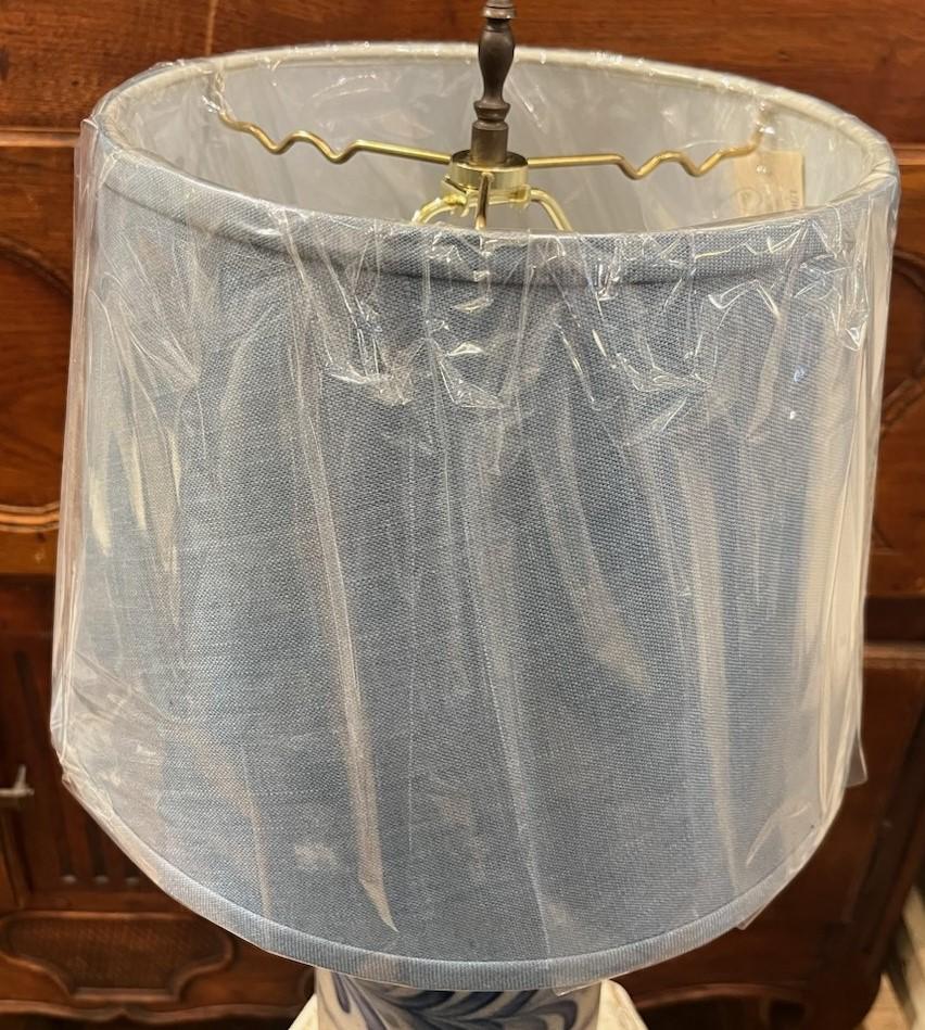 Later version of a 20thc stoneware lamp with original blue paint. newly wired with new linen shades. Great look and ready to connect and use. 

stamped 1993 on back.