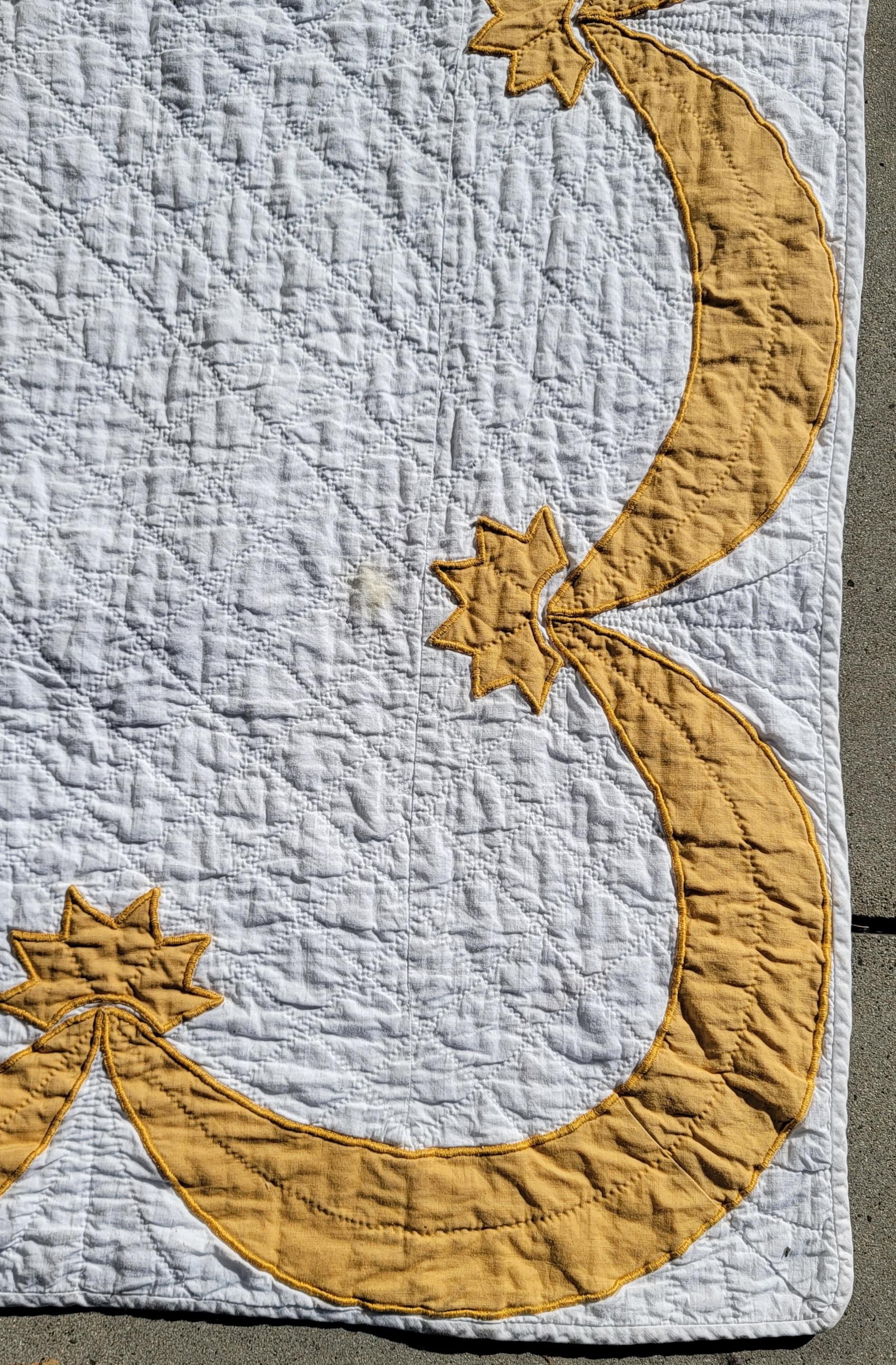 This fine eagle applique is in pristine condition. The swag border is quite nice as well and the quilt has very nice stitching and piecing. The quilt is so unusual in a golden rod color.