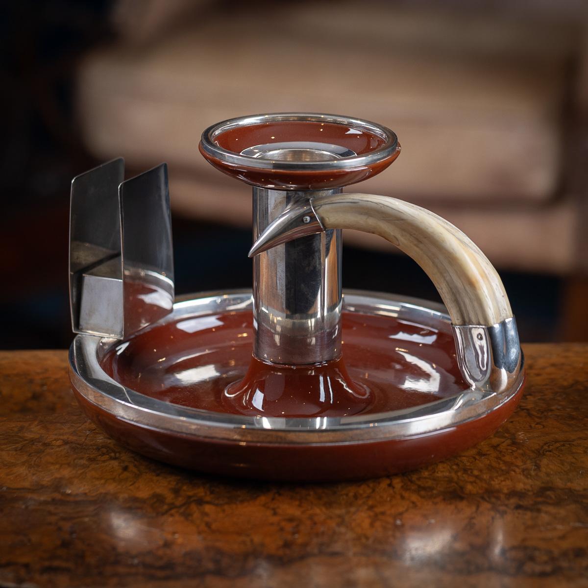 Antique early 20th Century German solid silver, ceramic, and boar tusk ashtray with a large match box holder. Circular in form, featuring a dark red ceramic ashtray and tray, with silver rim. Fitted with a match box holder to one side and a mounted