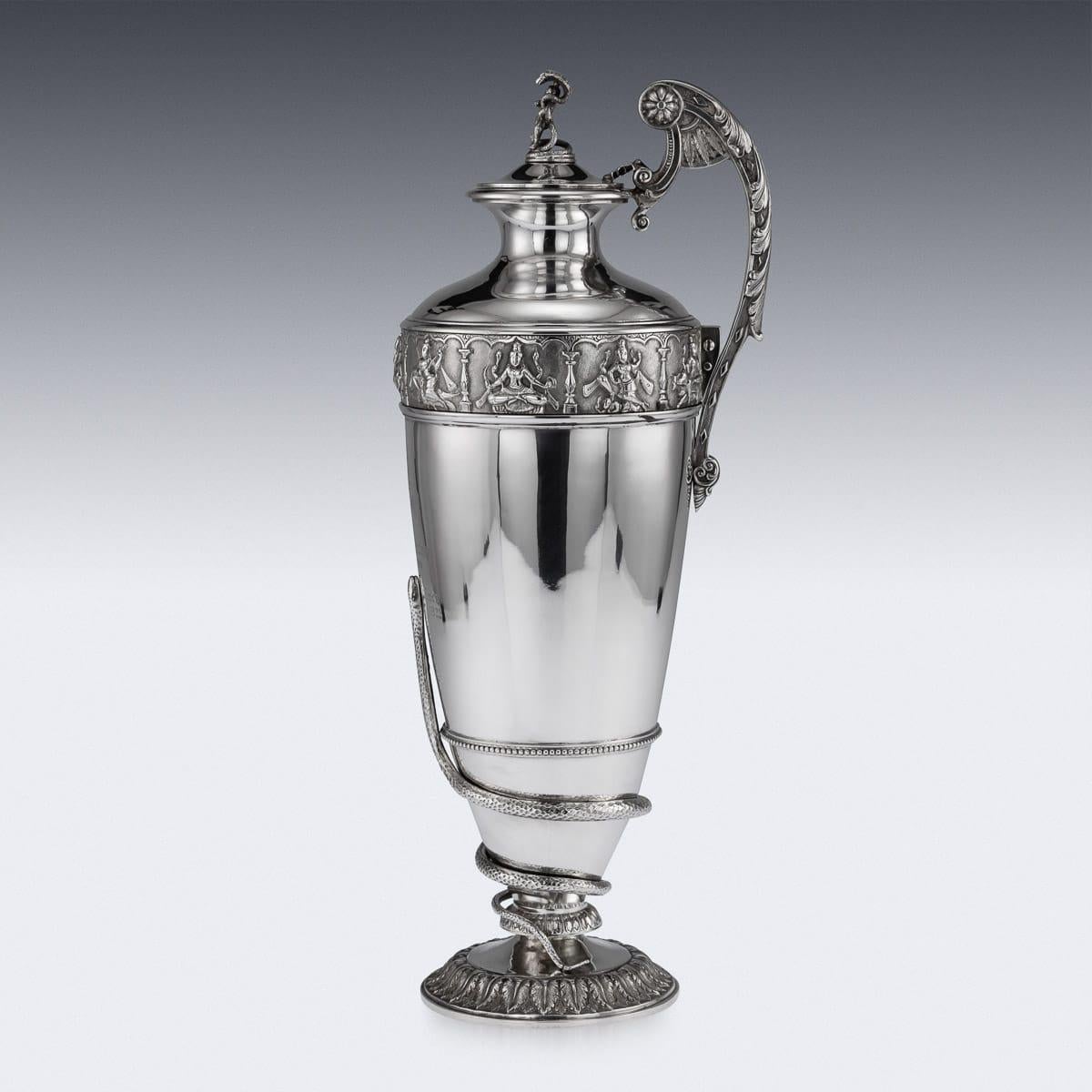 Antique early-20th Century Indian Colonial solid silver regimental (28th Regiment) commemorative wine ewer, the top band is beautifully chased and repousse' decorated depicting Hindu gods and goddesses in elaborate cartooches, and the bottom applied