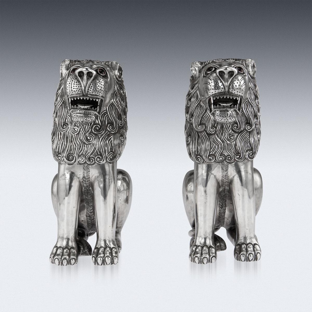 Antique early-20th Century Indian (Rajasthani) Monumental solid silver pair of throne lion figures. The pair are exceptionally large and impressive, the design is inspired by the Islamic Mughal period decoration and style suggests that the statues