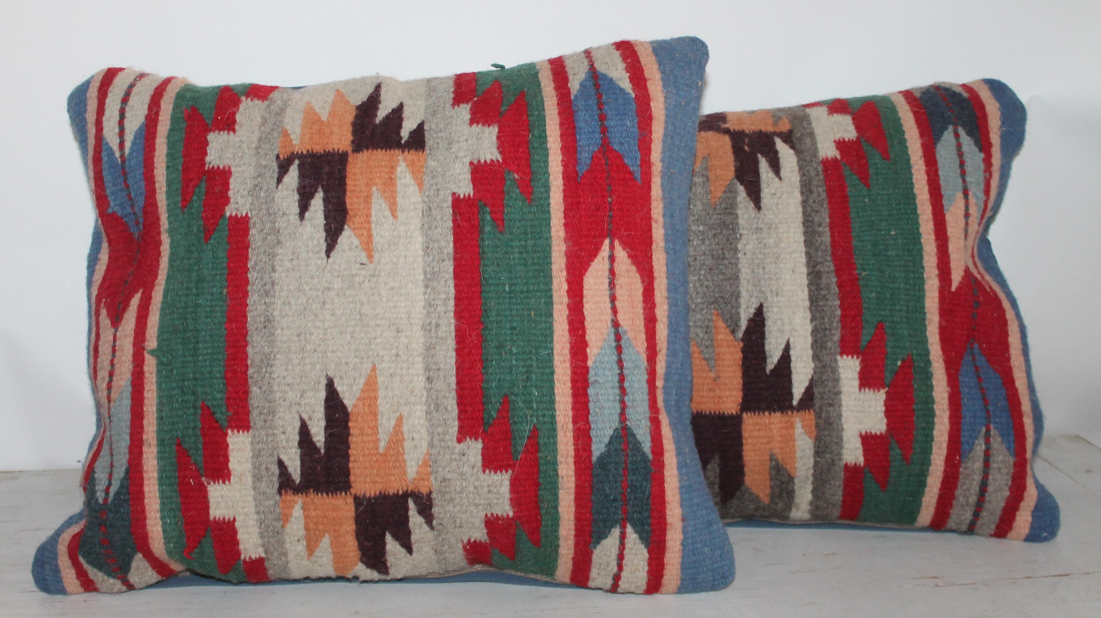 These Indian weaving pillows have blue linen backings. These pillows are made from Mexican / American Indian weaving's. Sold in pairs.