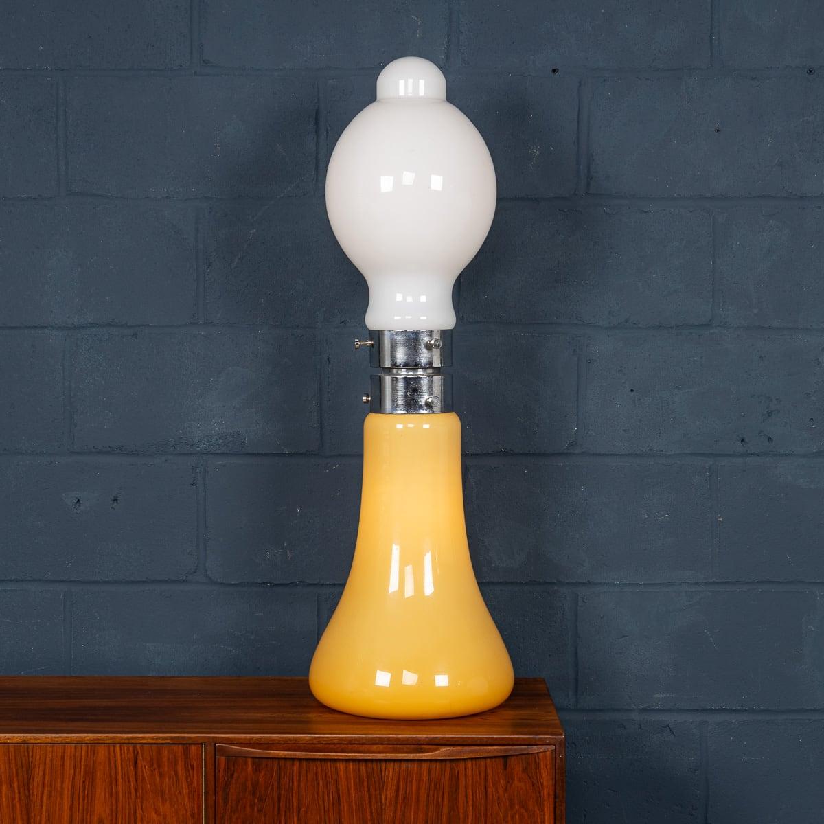 A wonderful vintage Italian table lamp made by Carlo Nason for Mazzega. Produced in Murano, Venice in the 1970s, this chrome and glass lamp exemplifies Carlo Nason’s workmanship. Using vibrant colours, Nason has used a bright orange glass for the