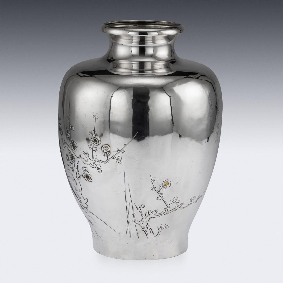 Antique early 20th century Japanese Meiji period solid silver and mixed-metal large vase. The bulbous body chased and applied with budgerigar with copper, gold and gilt details, parched on a blooming cherry tree branch, the vase features exceptional