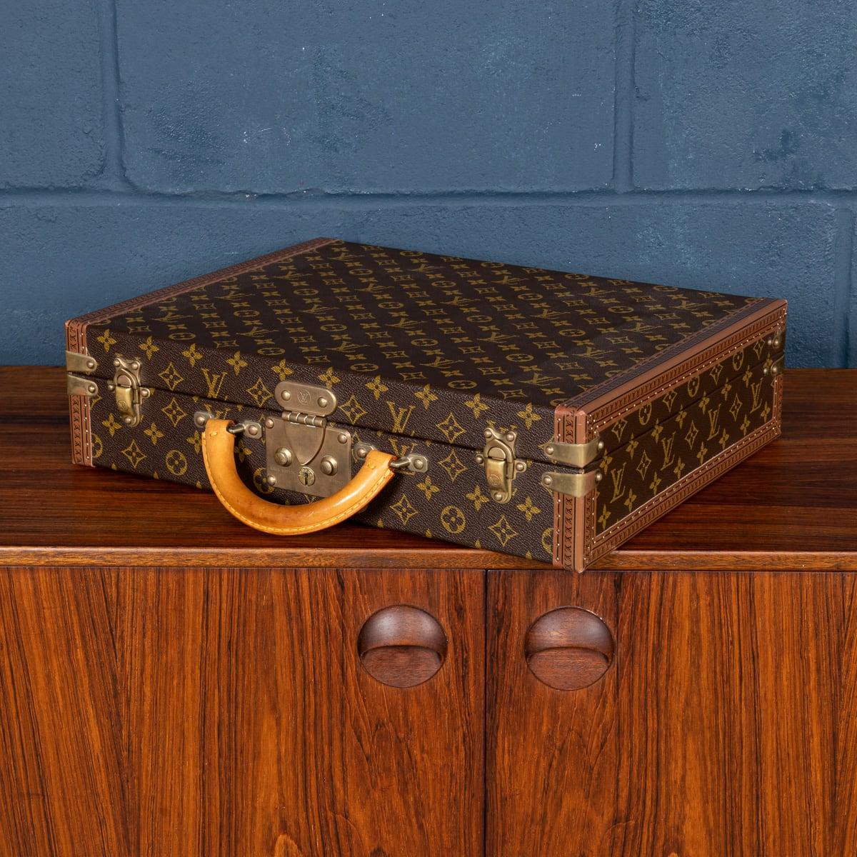 A charming Louis Vuitton hard-sided case, late 20th century, the exterior finished in the famous monogram canvas with brass fittings. This beautiful example is in great condition, all of its brassware working as new. A wonderful and useful item that