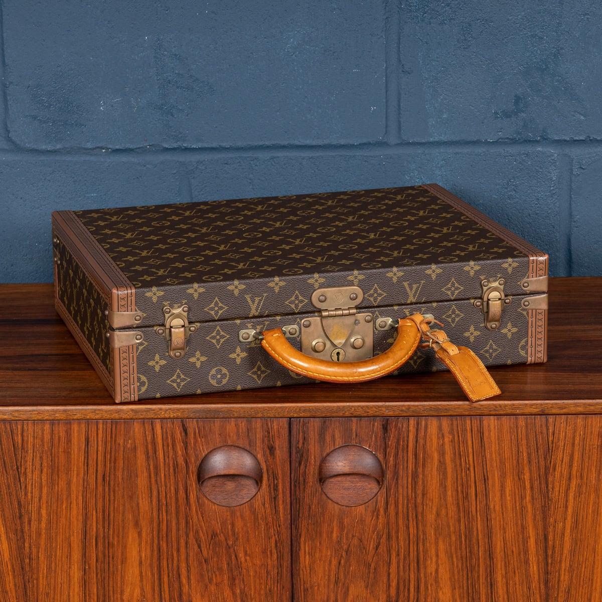 A charming Louis Vuitton hard-sided case, late 20th century, the exterior finished in the famous monogram canvas with brass fittings. This beautiful example is in great condition, all of its brassware working as new. A wonderful and useful item that