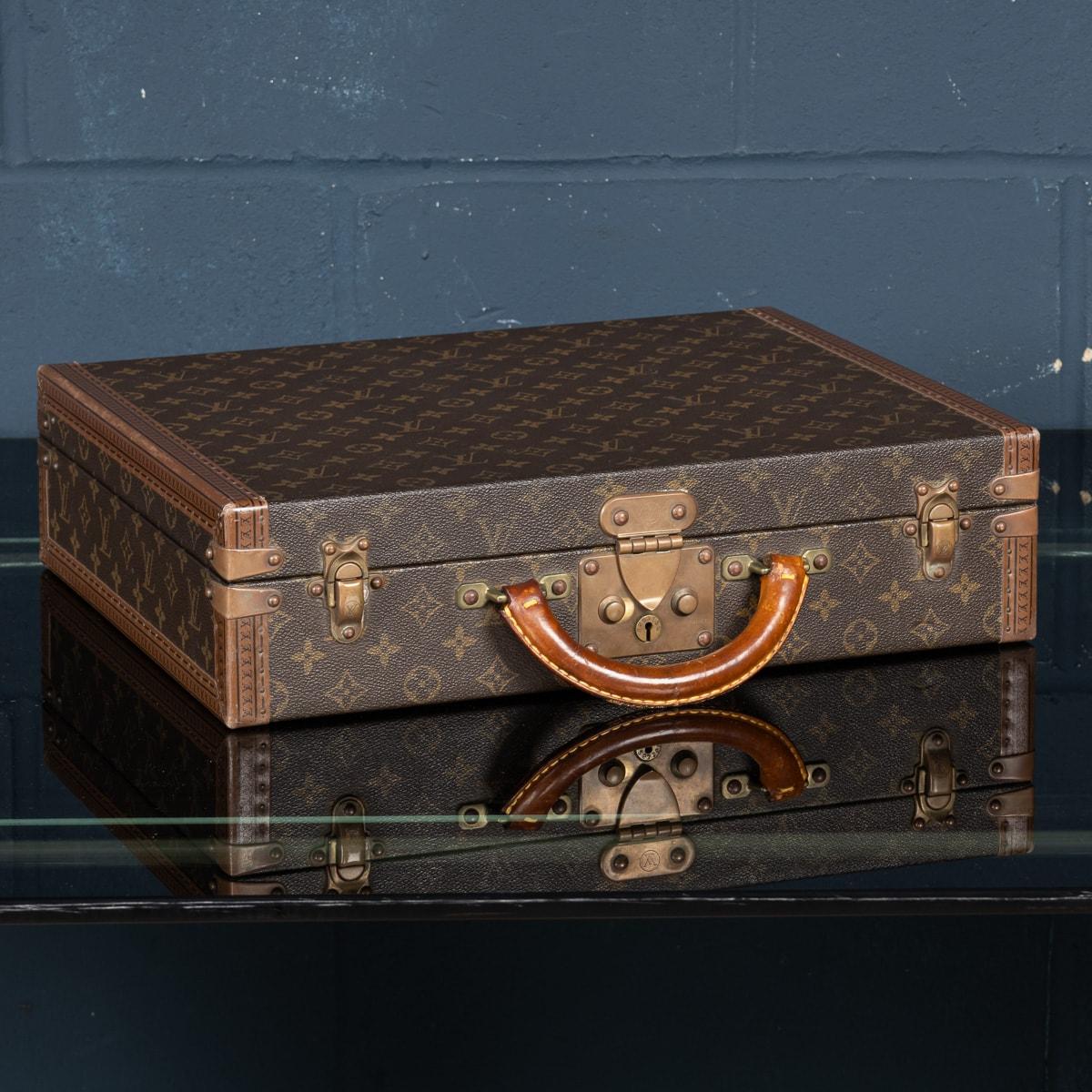 A charming Louis Vuitton hard-sided case, late 20th century, the exterior finished in the famous monogram canvas with brass fittings. This beautiful example is in great condition, all of its brassware working as new. A wonderful and useful item that