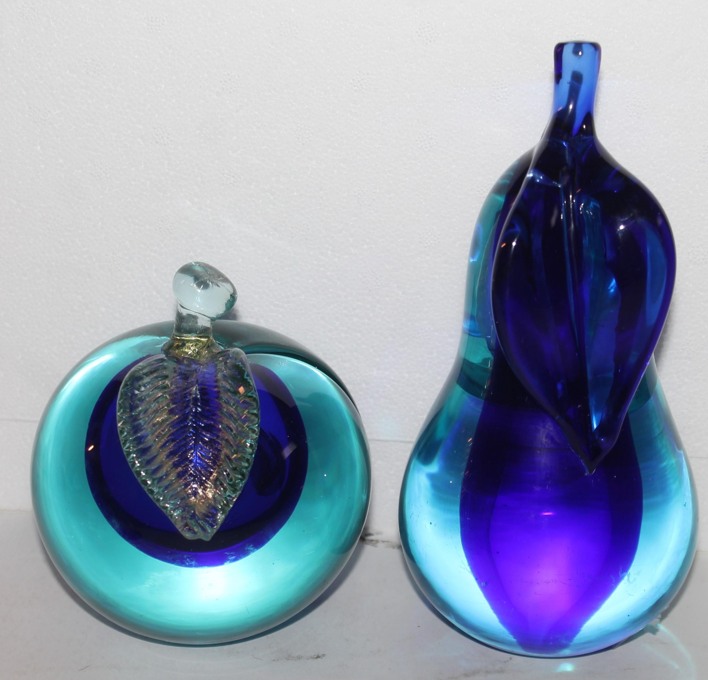 These hand made glass apple & pear bookends in fine condition. The deep blue & clear color. Pear is 6'high and the apple is 4