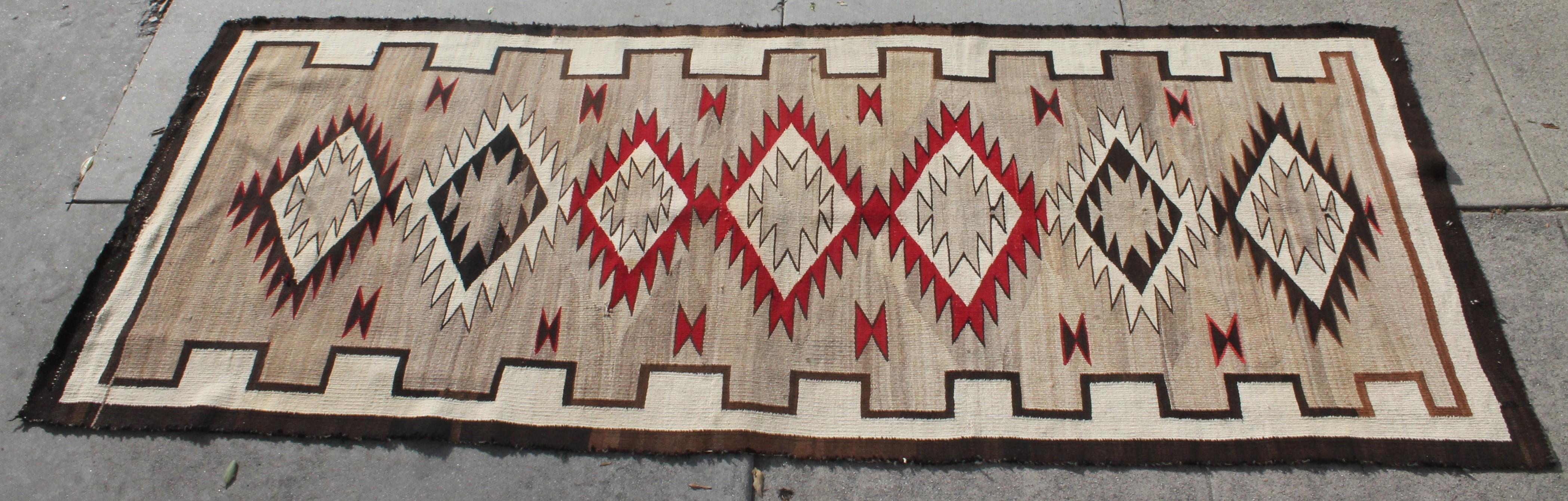 Navajo runner eye dazzler weaving in very good condition. Professionally cleaned and very rare to find Navajo runners of this quality and condition. Minor repair to one edge.