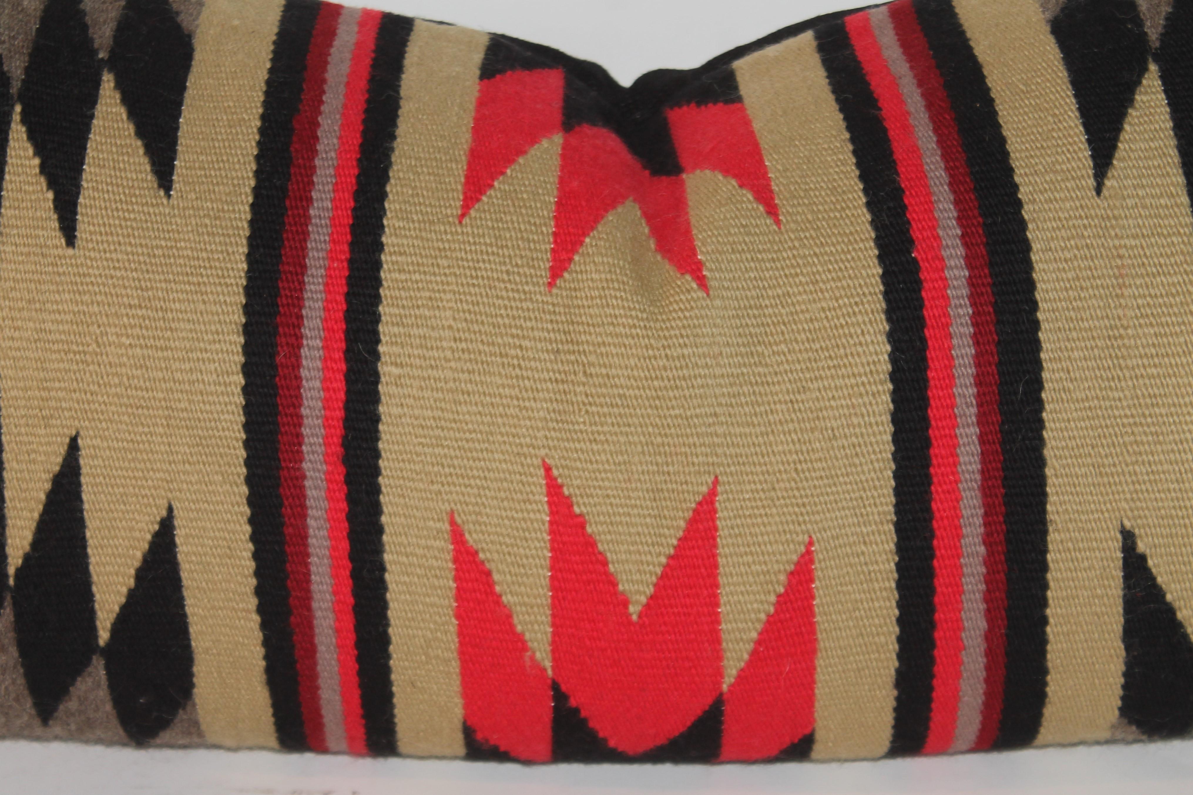 This amazing Navajo Indian weaving bolster pillow in very good condition. The backing is in black linen. The insert is down & feather fill.