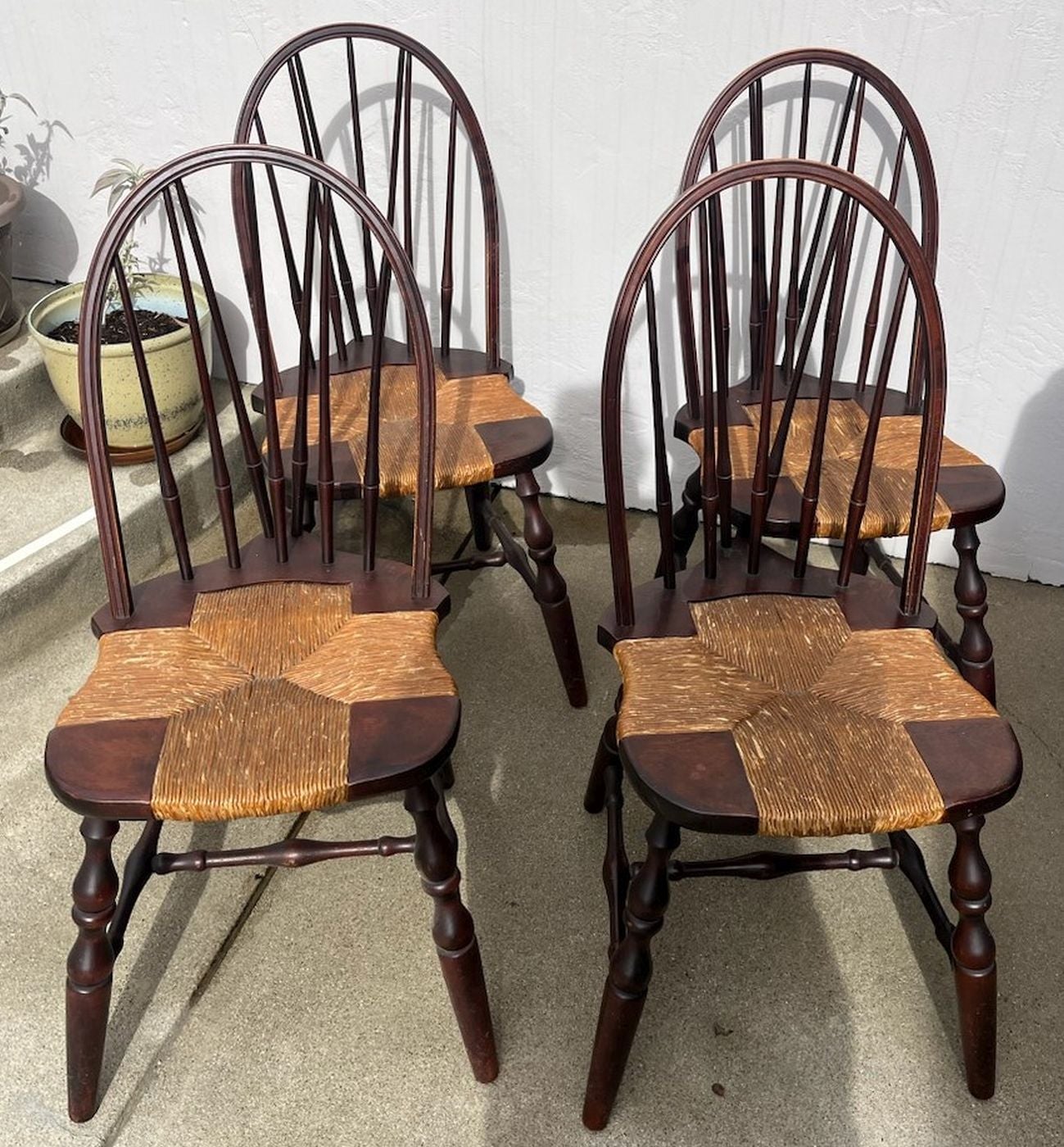 Set of four signed Nichols & Stone Windsor dining chairs, circa 1930s, original rush seats and signed on the base.
Chairs are in great condition.