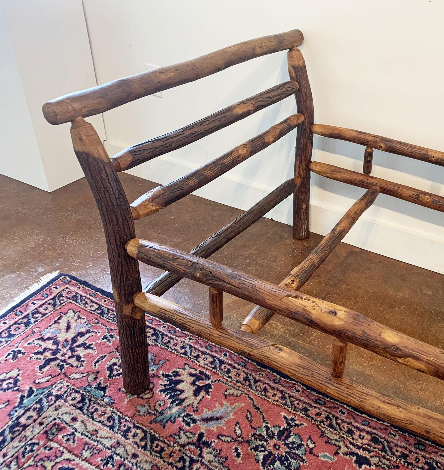 This handsome hickory pole daybed has flared ends and spindled side rails. When topped with a thick piece of foam and pillows (as shown in final photos, not included) it makes a nice sitting bench or cot as a stylish addition to a room’s furniture