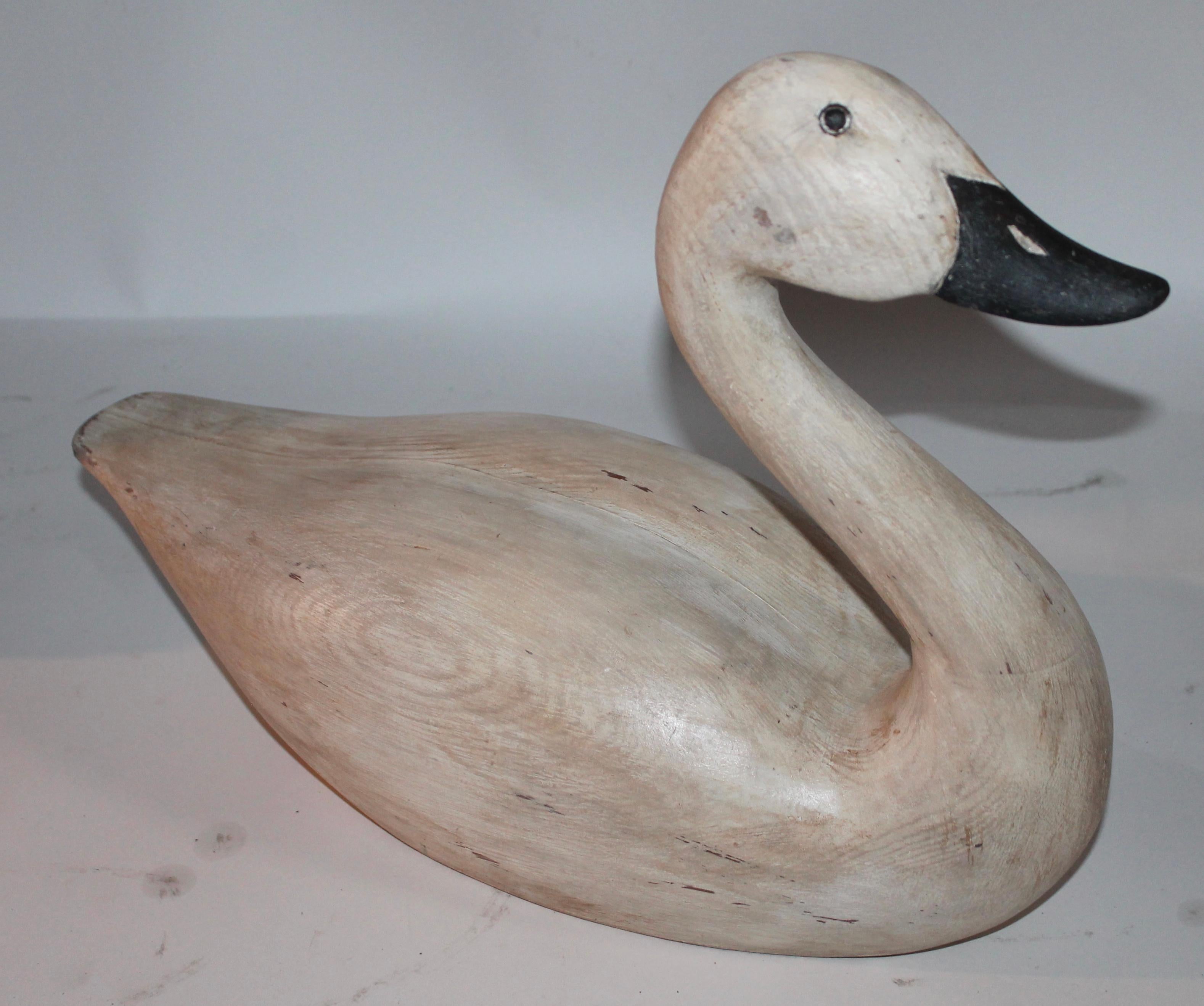 This folky hand carved and painted Canadian goose is from the forties and probably made in Canada. The condition is good with minor wear on tail feather area and base. Wear is consistent from age and use. Nice patina on body.