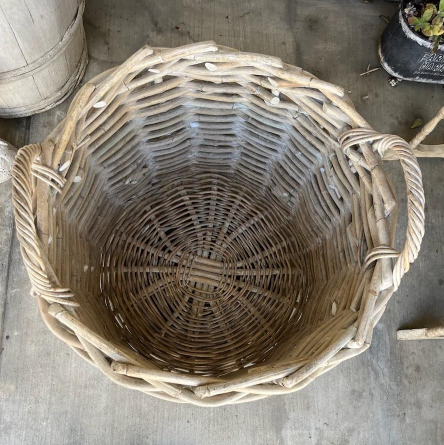 Large early 20thc white painted double handled basket with great original surface.The basket is in fine as found condition.
