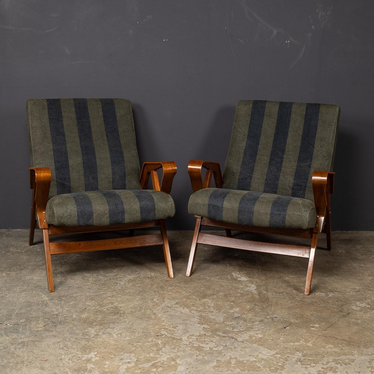 A wonderful pair of mid 20th Century bentwood chairs, crafted for a Czech company, Tetra, by the skilled hands of Frantisek Jirak. Adorned in its original striped fabric, this pair of '60s chairs are a superb addition to any household both modern or