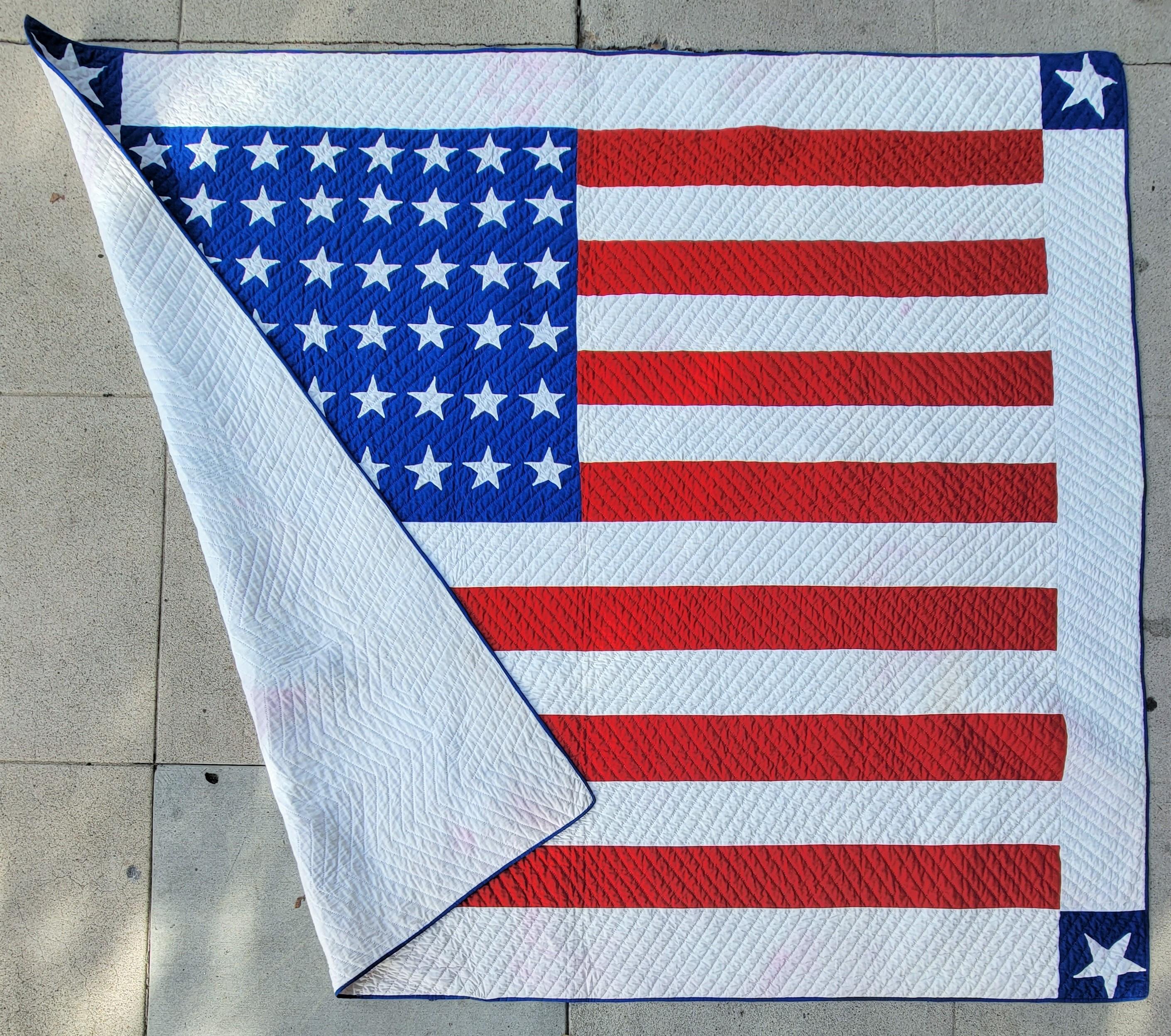 This amazing flag quilt with 48 hand quilted stars is in amazing condition. It is a one of a kind flag quilt. We sold this quilt over 21 years ago and got it back from the original buyer / collector. We bought it back from the original collector. It