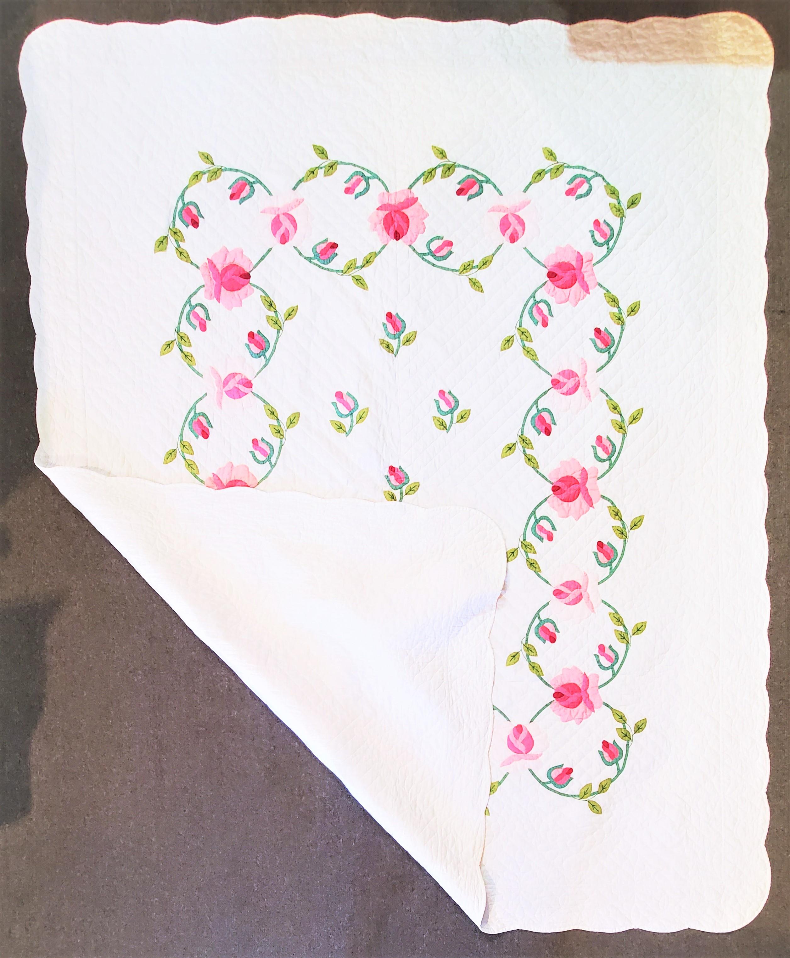 20th century hand applique roses quilt with fine tight quilting. The condition is very clean.