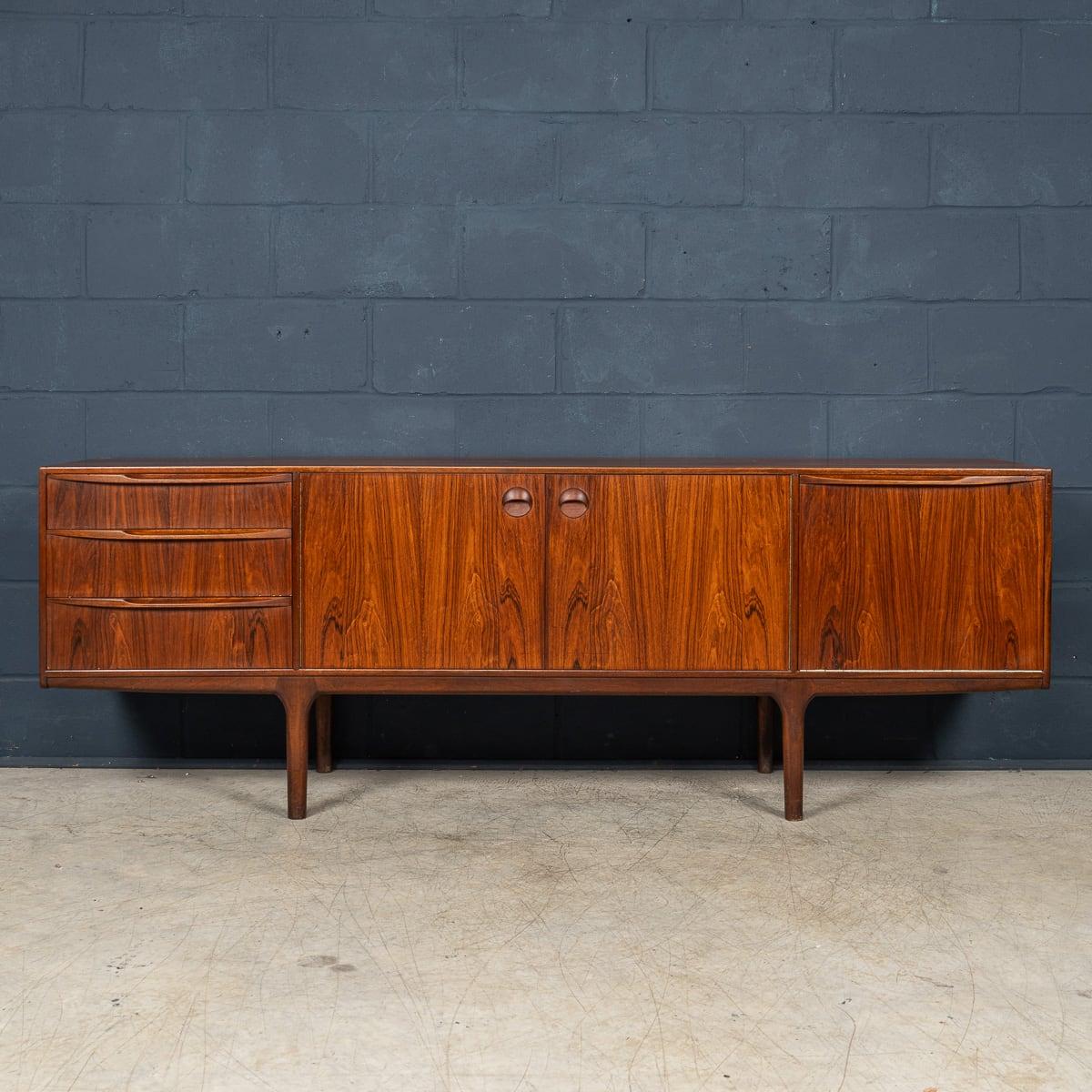 A beautifully designed rosewood ‘Dunvegan’ sideboard designed by Tom Robertson, manufactured by A.H. McIntosh of Kirkcaldy, Scotland. Dating from the 1960s, it was the flagship piece from the Danish-inspired Dunvegan collection. This very