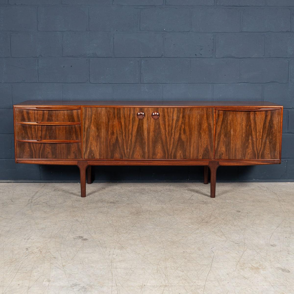 A beautifully designed rosewood ‘Dunvegan’ sideboard designed by Tom Robertson, manufactured by A.H. McIntosh of Kirkcaldy, Scotland. Dating from the 1960s, it was the flagship piece from the Danish-inspired Dunvegan collection. This very