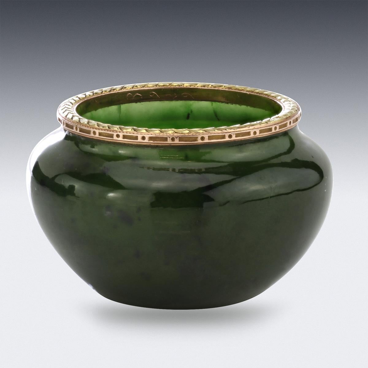 Antique early 20th century Russian Fabergé gold mounted nephrite bowl, circular bulbous body, applied with a chased laurel border. Hallmarked Russian gold 56 (585 standard), St-Petersburg, year 1899-1903, Makers mark of Michael Perchin, with